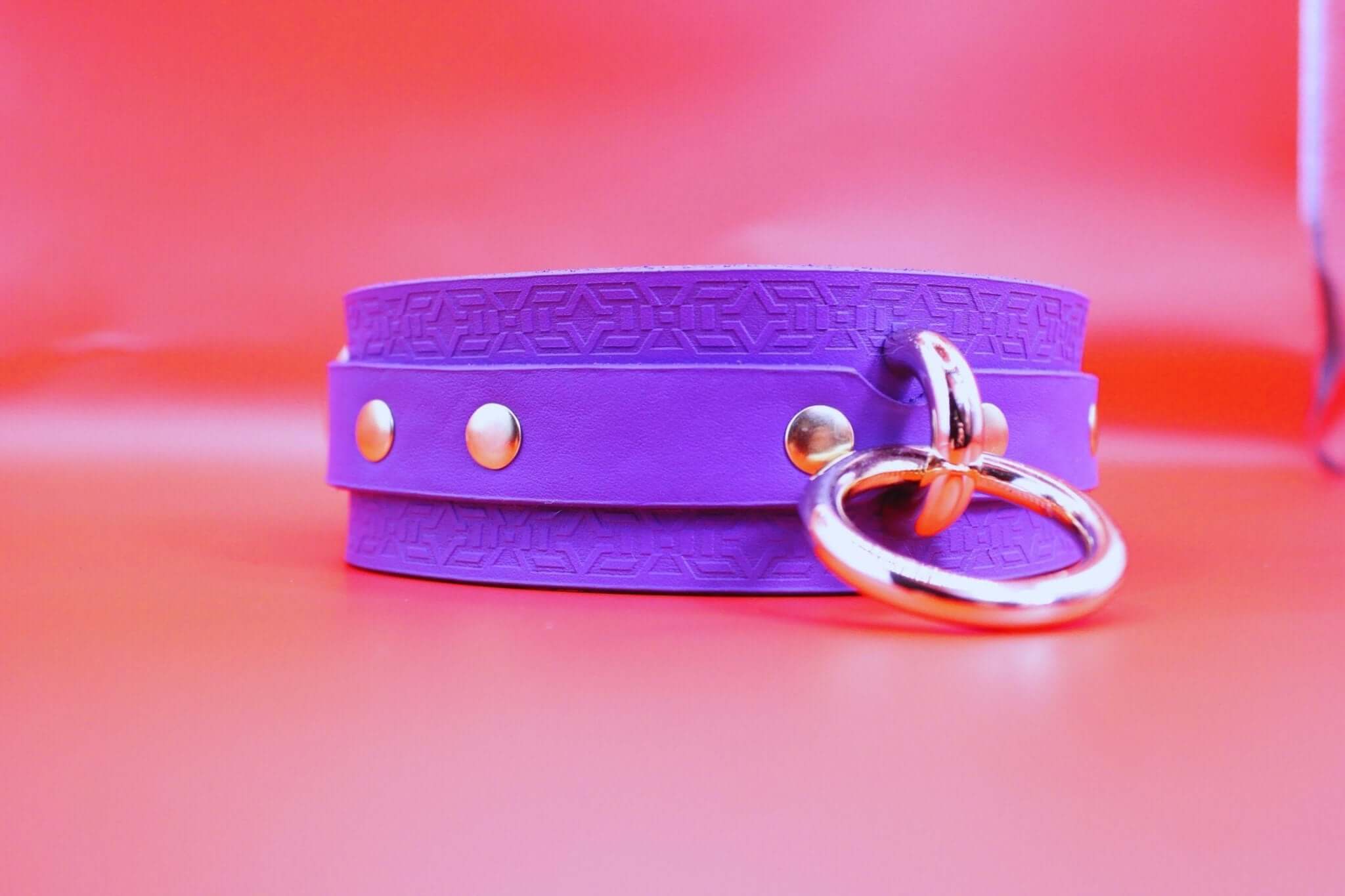 Vibrant violet leather BDSM collar with metal hardware, ideal for discreet daily wear and pet play gear.