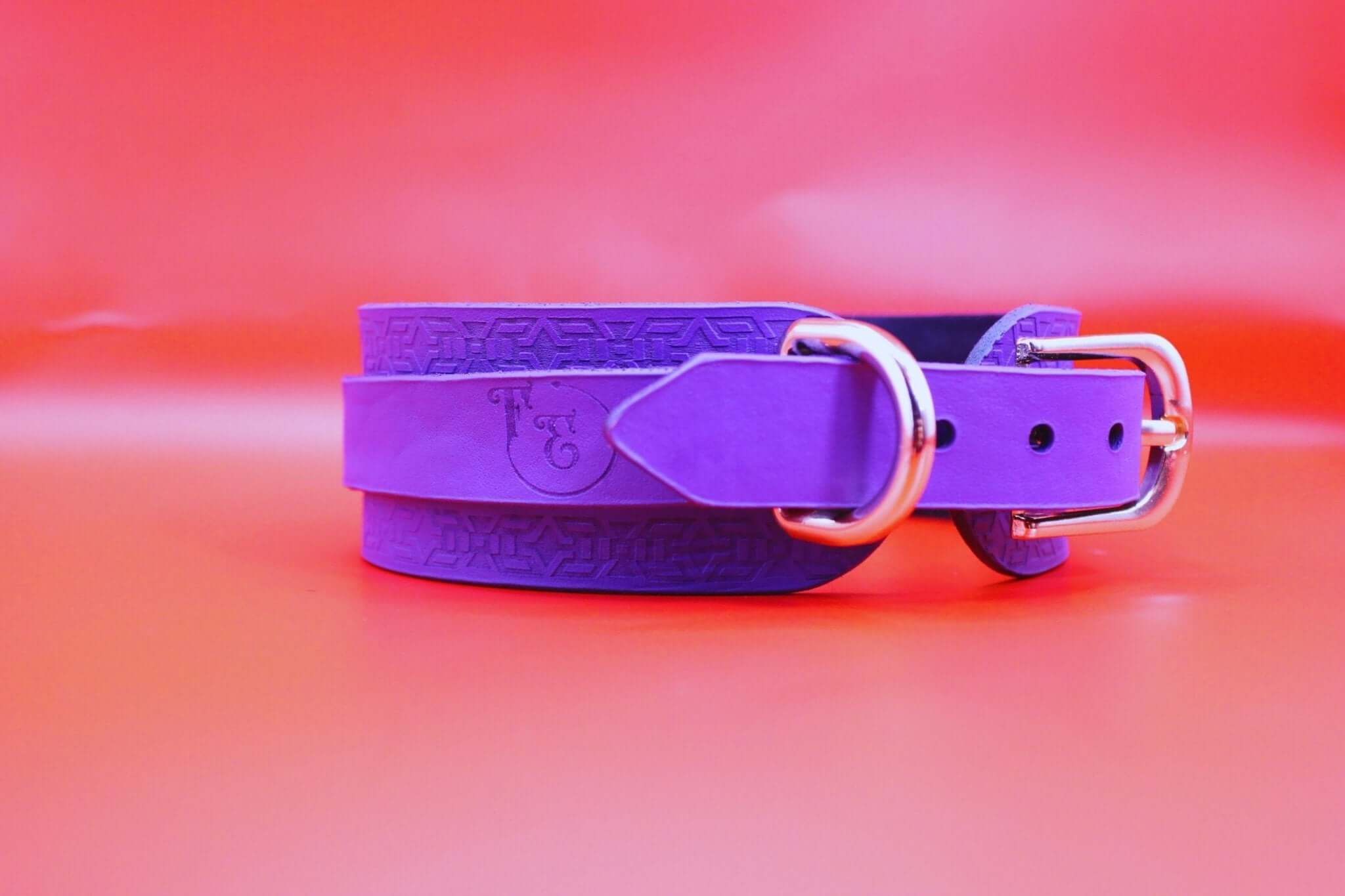 Handcrafted violet leather choker collar, perfect for BDSM and discreet day wear, featuring polished metal hardware.
