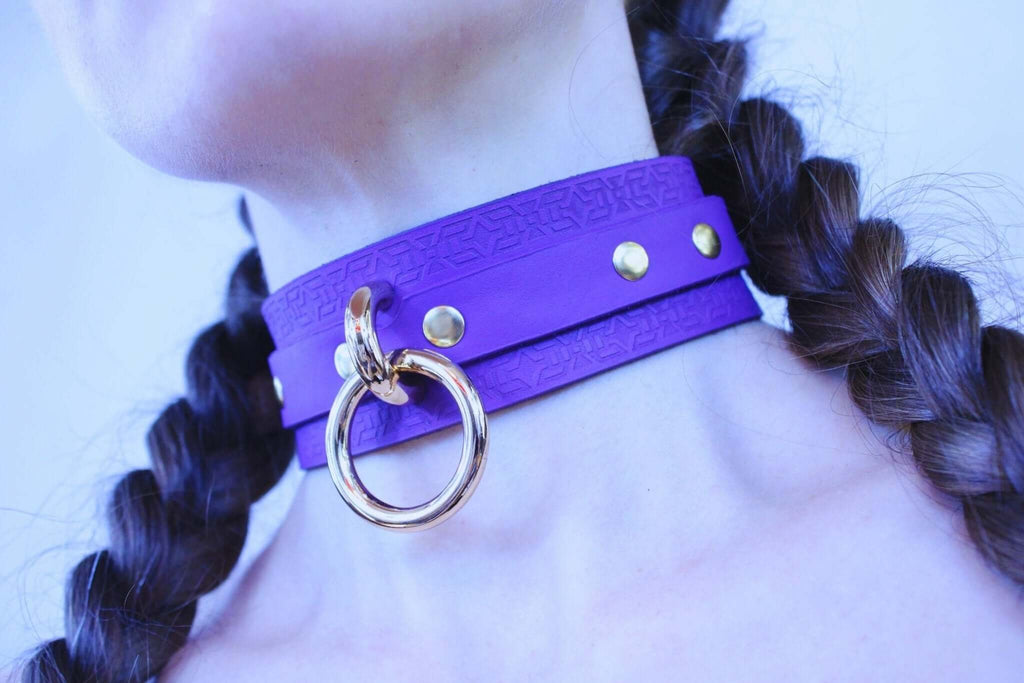 Violet leather BDSM choker collar with gold hardware, perfect for discreet day wear and submissive jewelry.