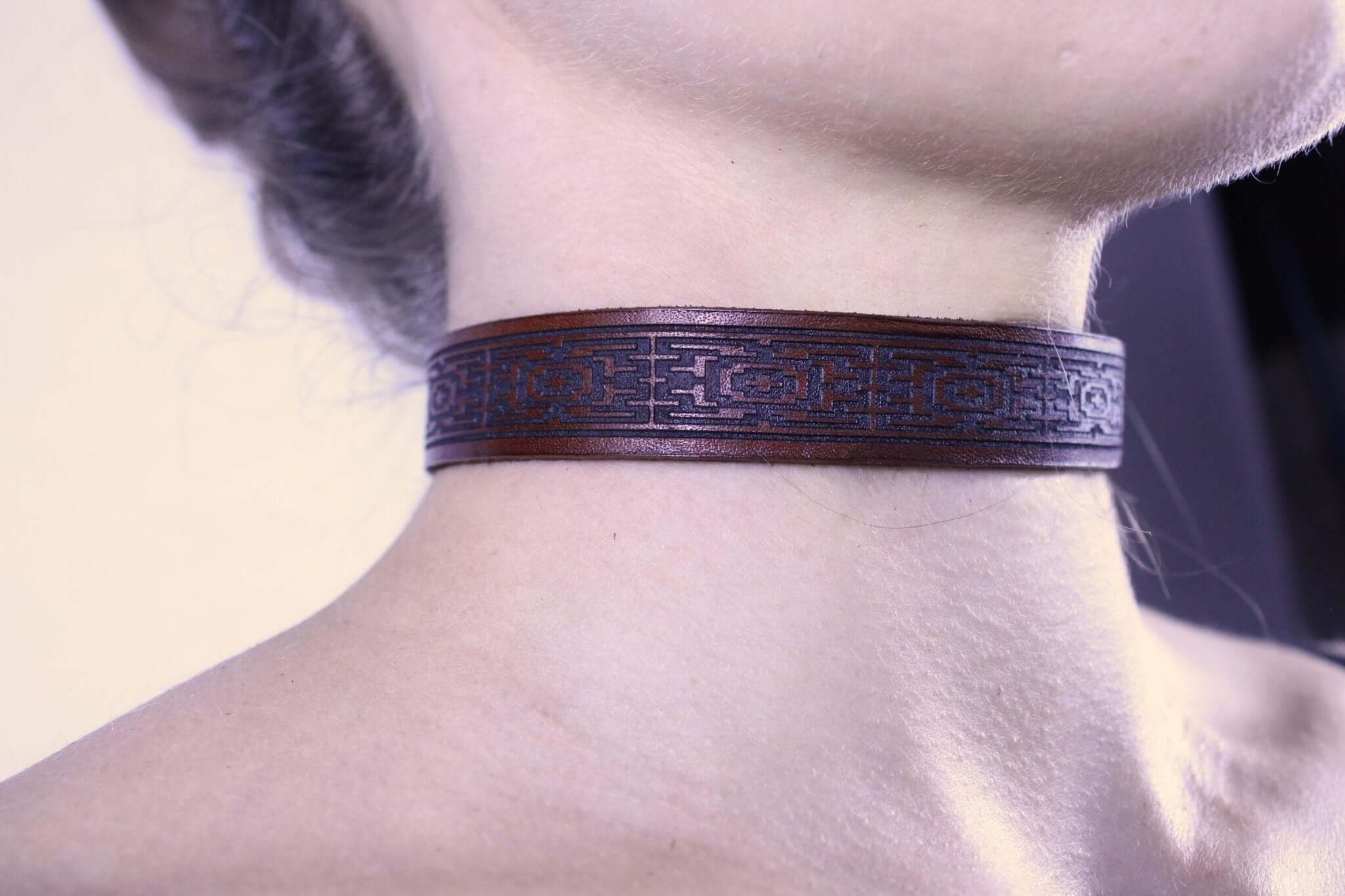 Handcrafted leather sub collar with intricate design, perfect for BDSM and submissive jewelry. Ideal dom sub gift.