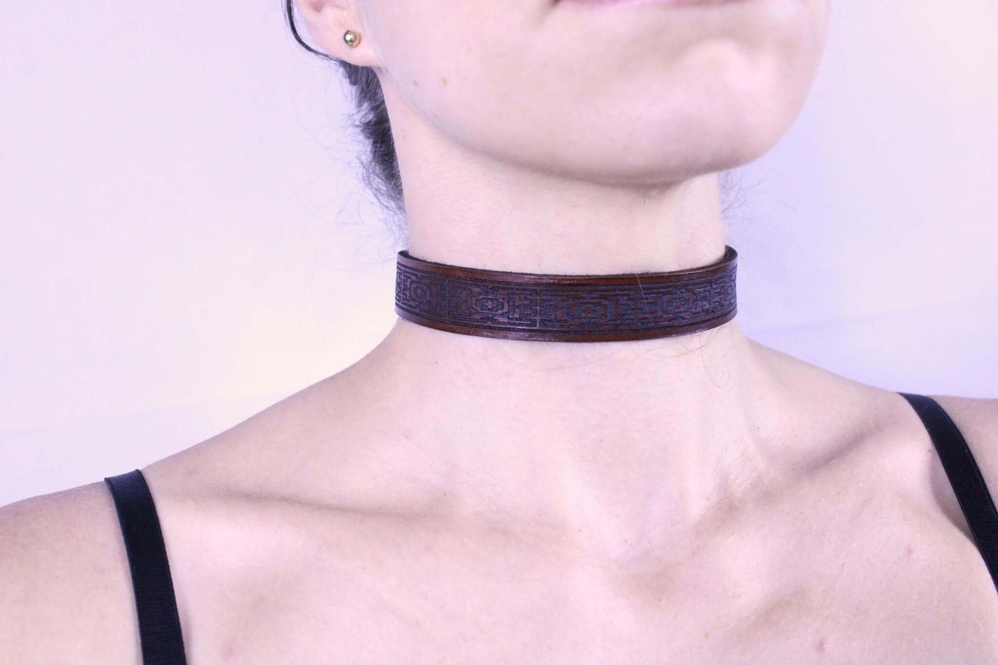 Handcrafted leather submissive collar showcasing an intricate geometric design, perfect for BDSM and dom sub gifts.