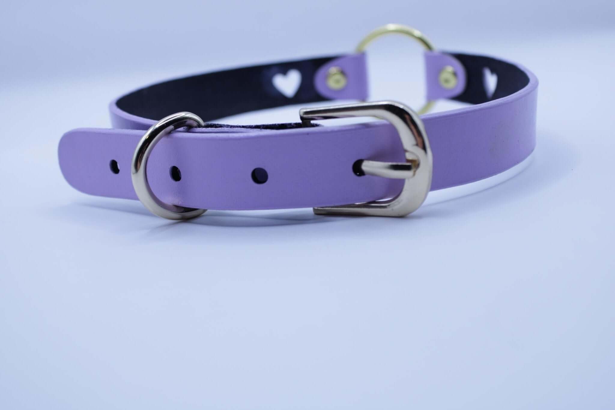 Lilac BDSM collar with heart cutout and gold O-ring, perfect for submissive jewelry and discreet day collar use.