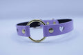 Lilac BDSM collar with heart cutout and gold O-ring, perfect for submissive jewelry and bondage fashion.