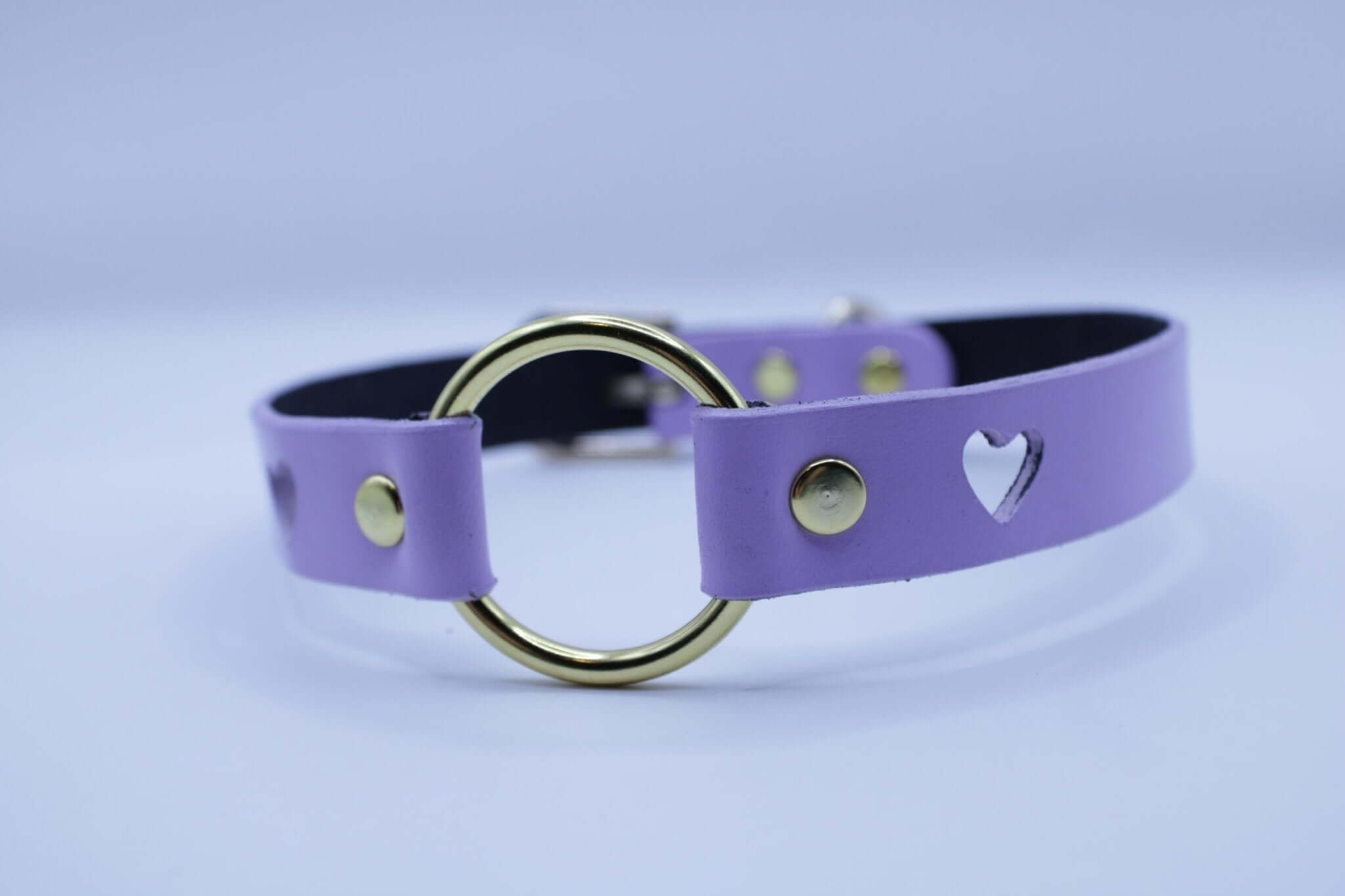 Lilac BDSM collar with heart cutout and gold O-ring, perfect for submissive jewelry and bondage fashion.