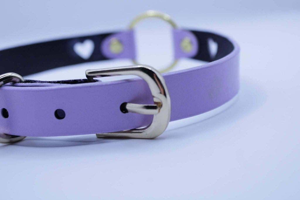 Lilac BDSM collar with heart cutout and gold O-ring, perfect for submissive jewelry and discreet day wear.