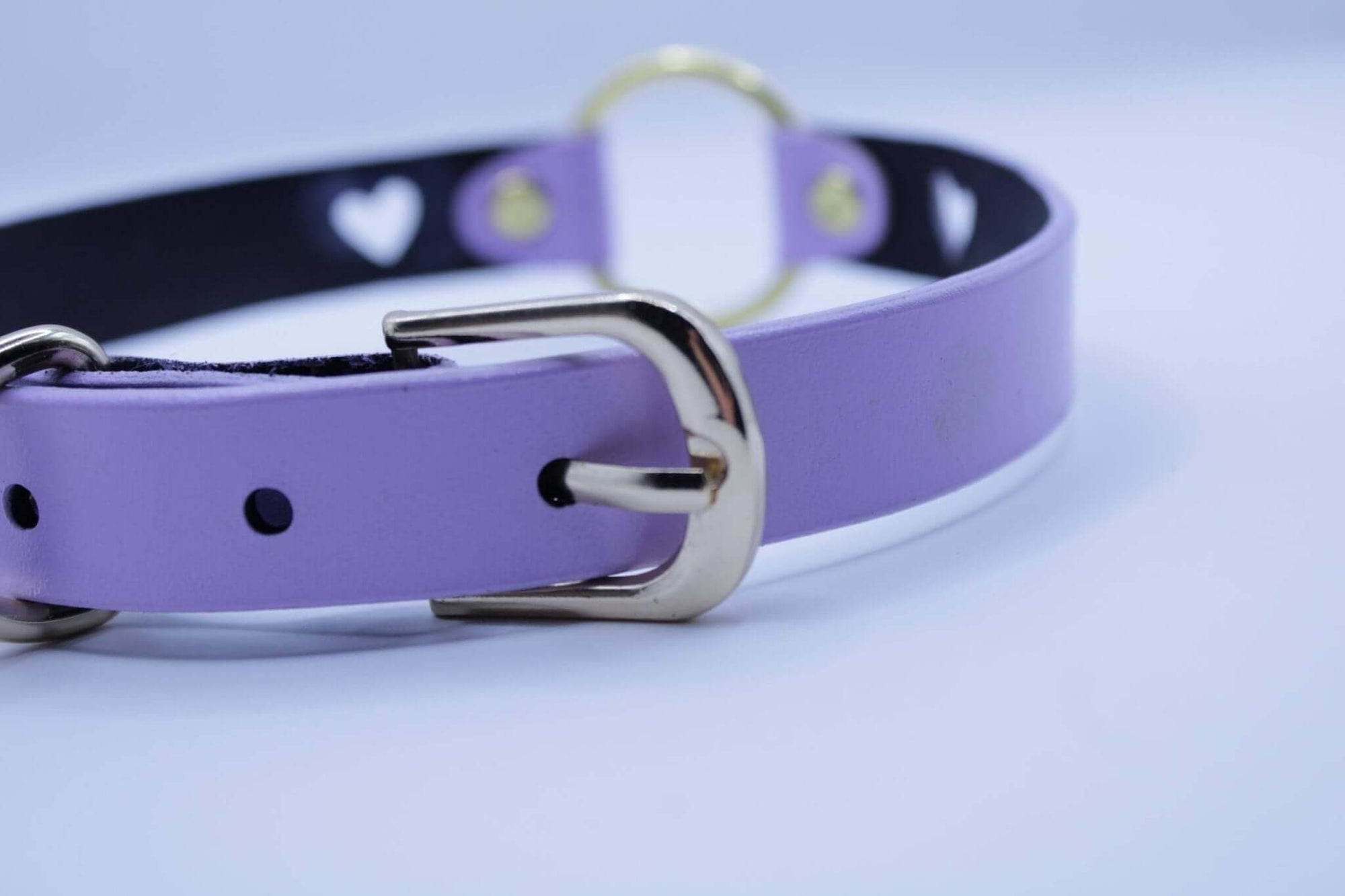 Lilac BDSM collar with heart cutout and gold O-ring, perfect for submissive jewelry and discreet day wear.