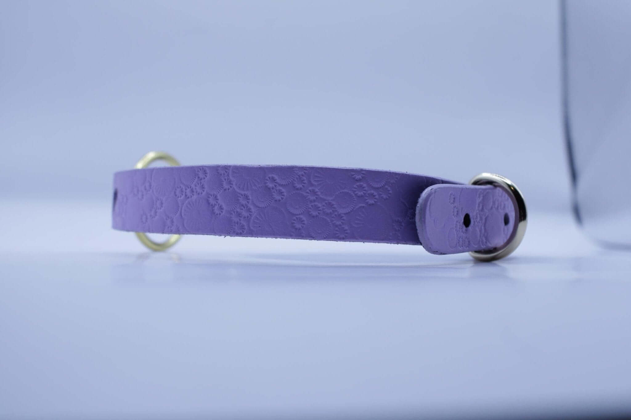 Lilac leather submissive collar with heart cutout, ideal for BDSM, bondage gear, and discreet day wear.