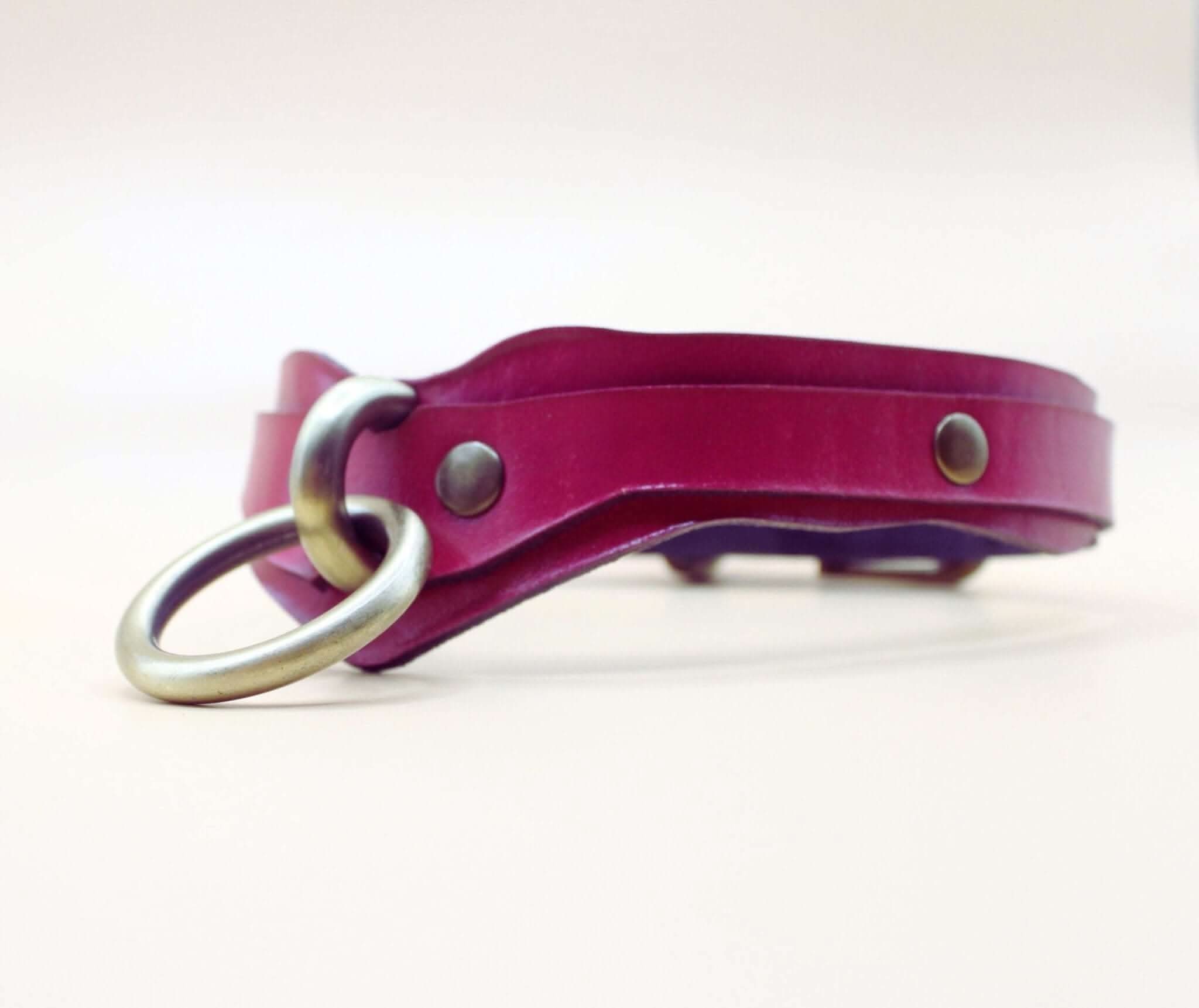 Magenta leather choker with O-ring, perfect as a BDSM collar or submissive necklace for confident expression.