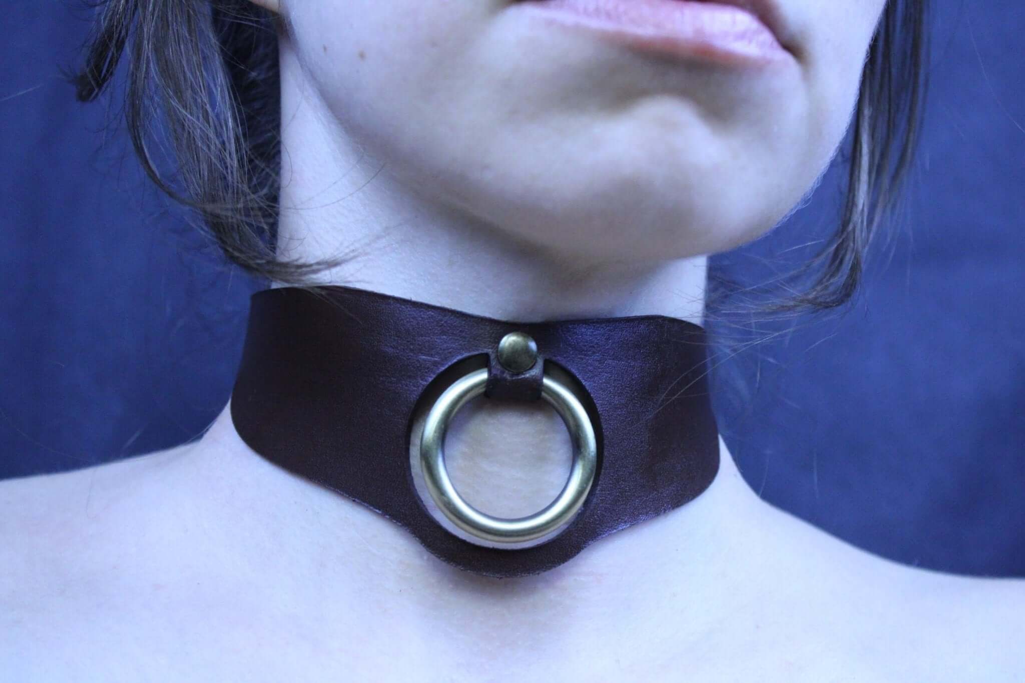 Minimalist leather posture collar with O-ring, perfect for BDSM jewelry and submissive accessories.