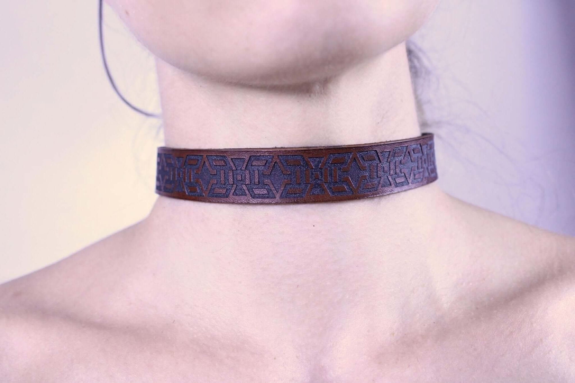 Handmade minimalist BDSM collar featuring a tribal geometric motif, perfect for submissive jewelry and discreet day wear.