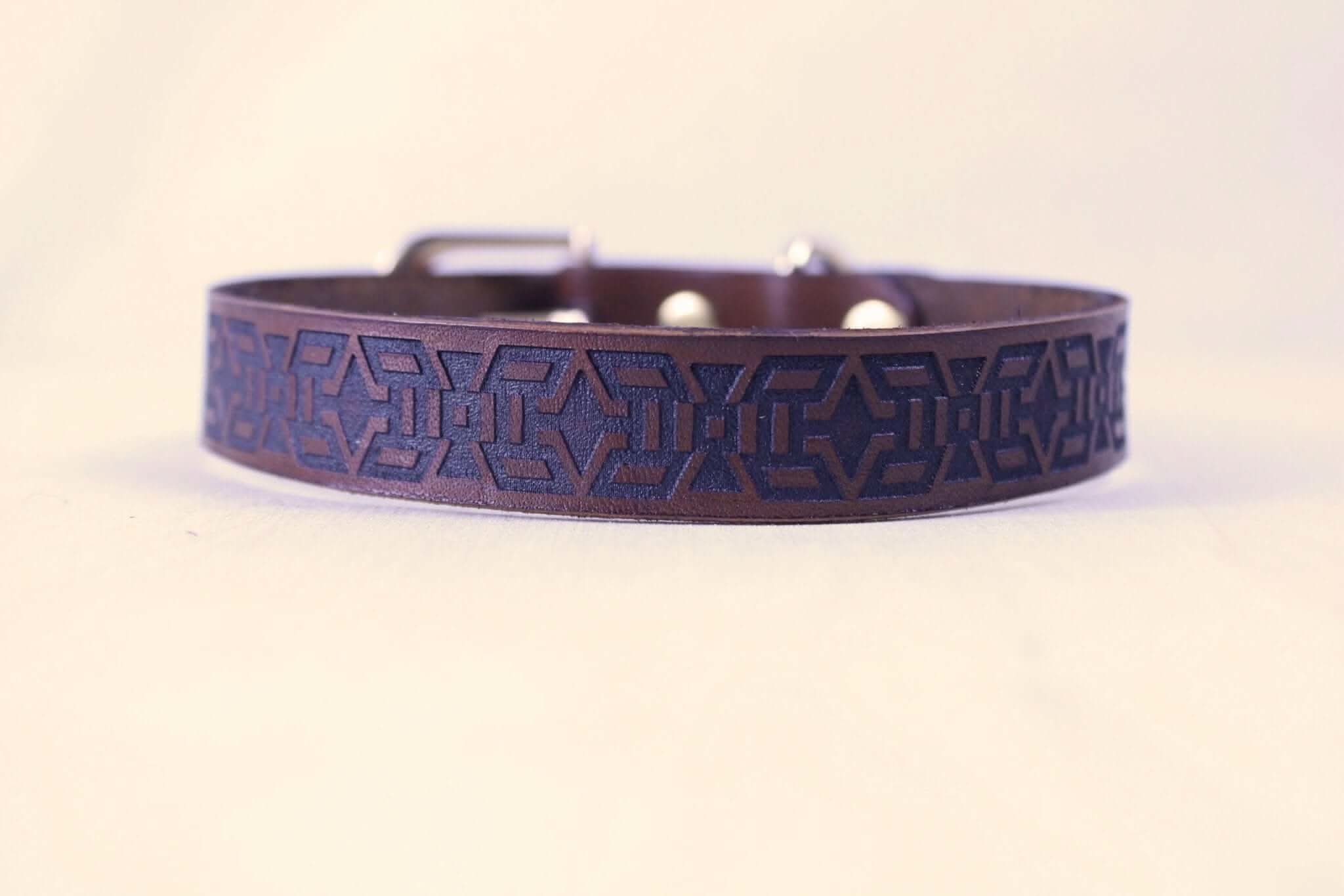 Handmade minimalist BDSM collar with tribal motif, perfect for discreet day wear and submissive jewelry.