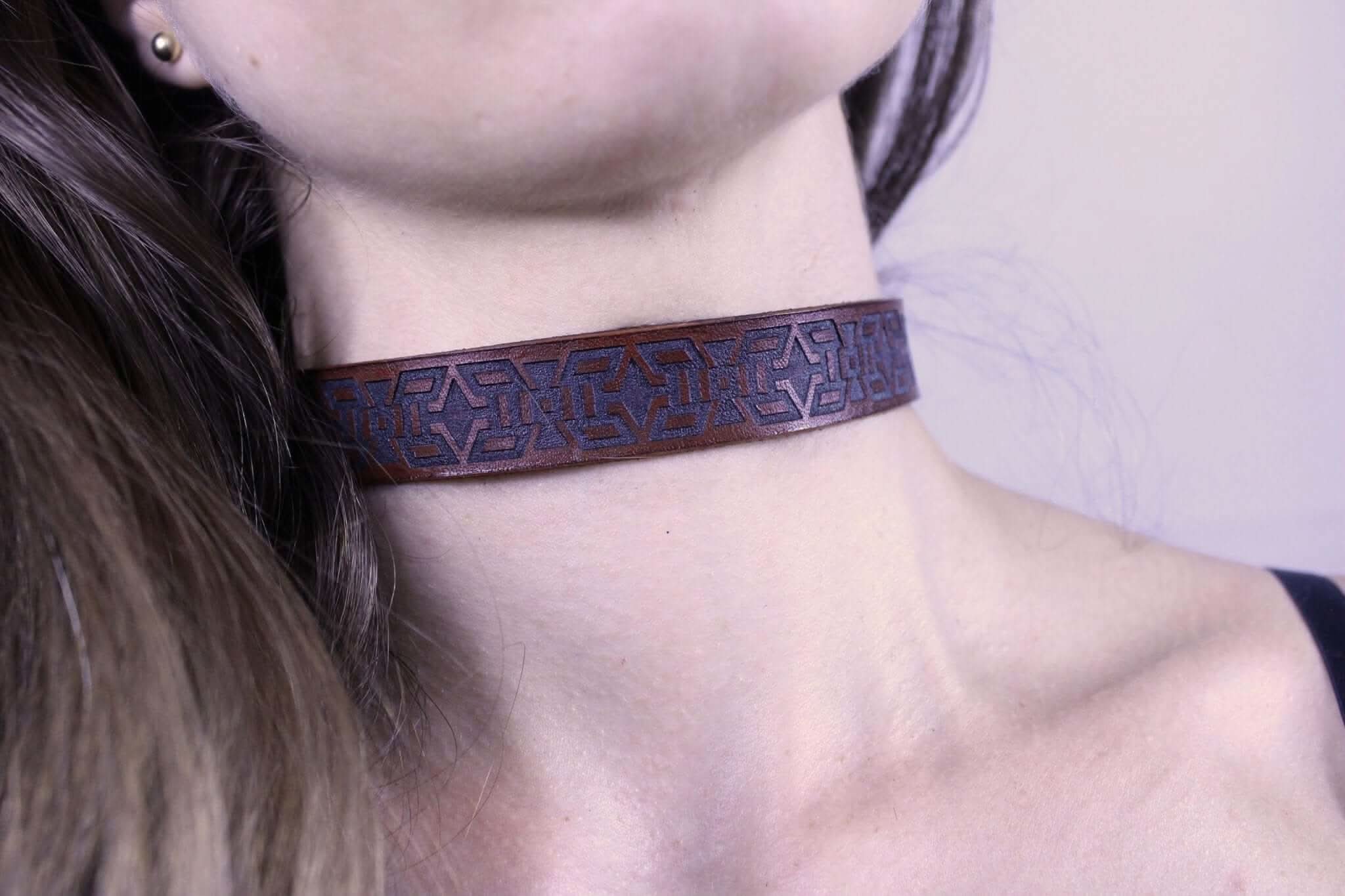 Handmade minimalist day collar with tribal motif, perfect for bondage and submissive jewelry enthusiasts.