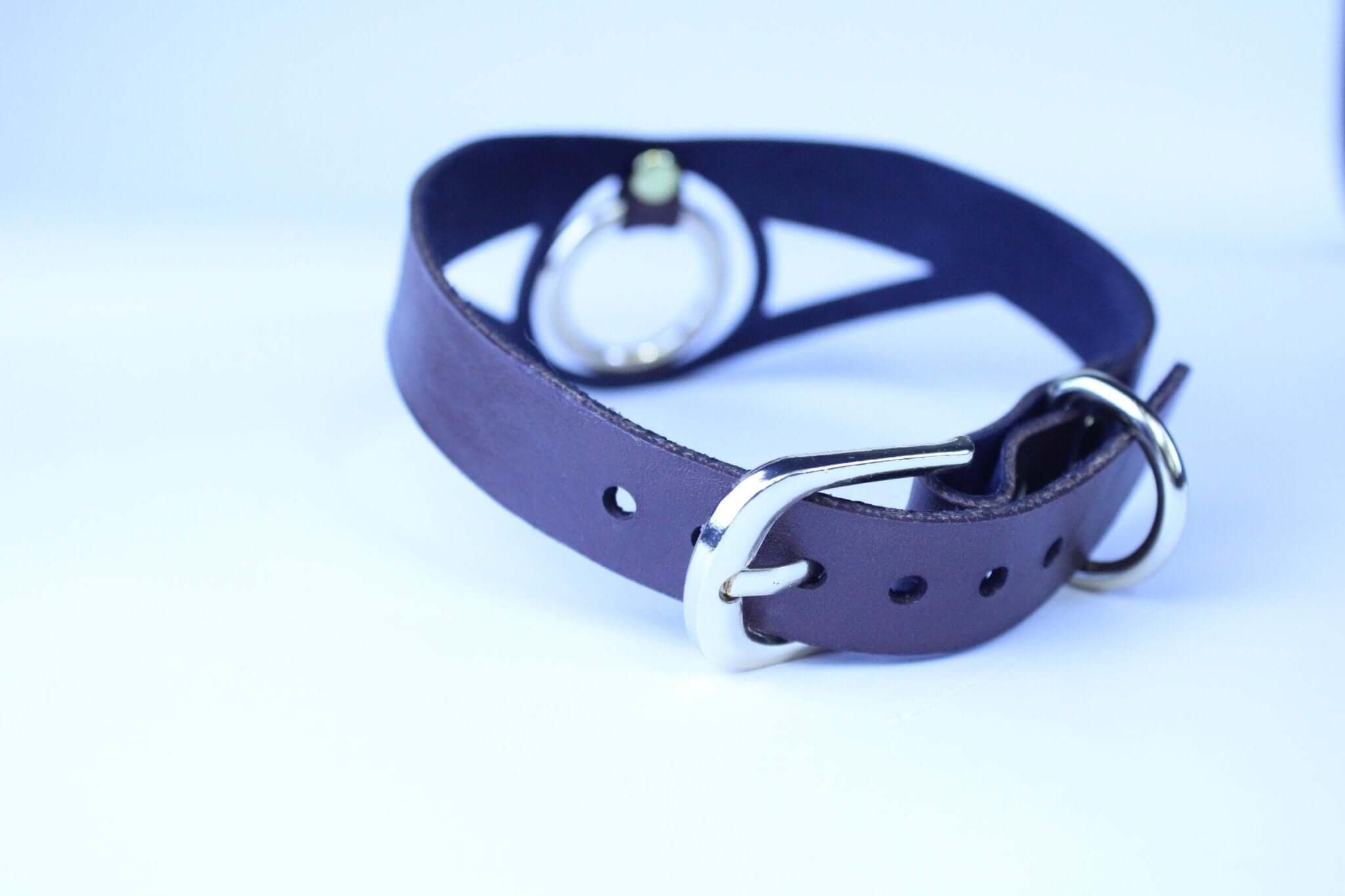 Minimalist leather BDSM posture collar with bold O-ring for submissive jewelry and bondage gear.
