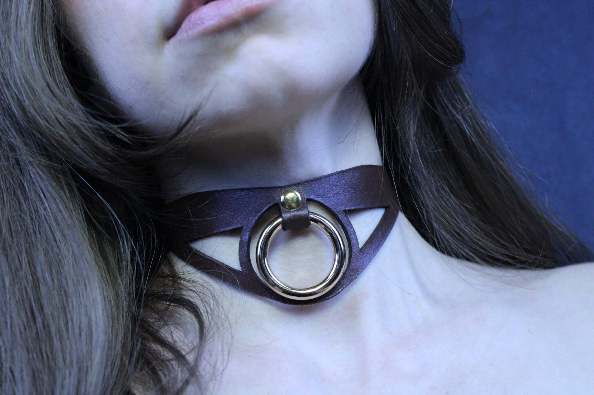 Minimalist black leather submissive collar with bold O-ring, perfect for BDSM, posture, and discreet day wear.