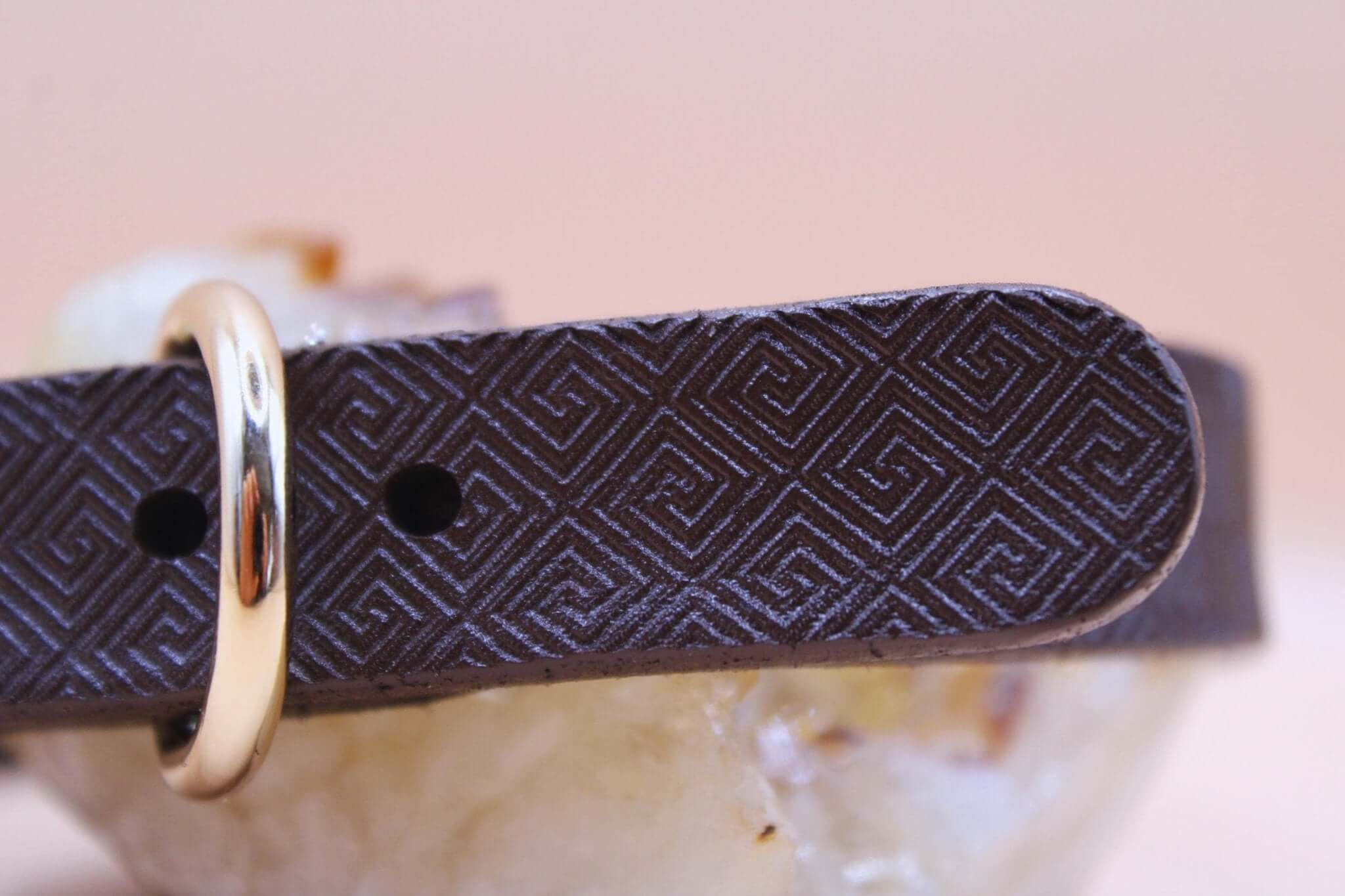 Minimalist dark brown leather submissive collar with geometric pattern and gold accent, perfect for BDSM jewelry.
