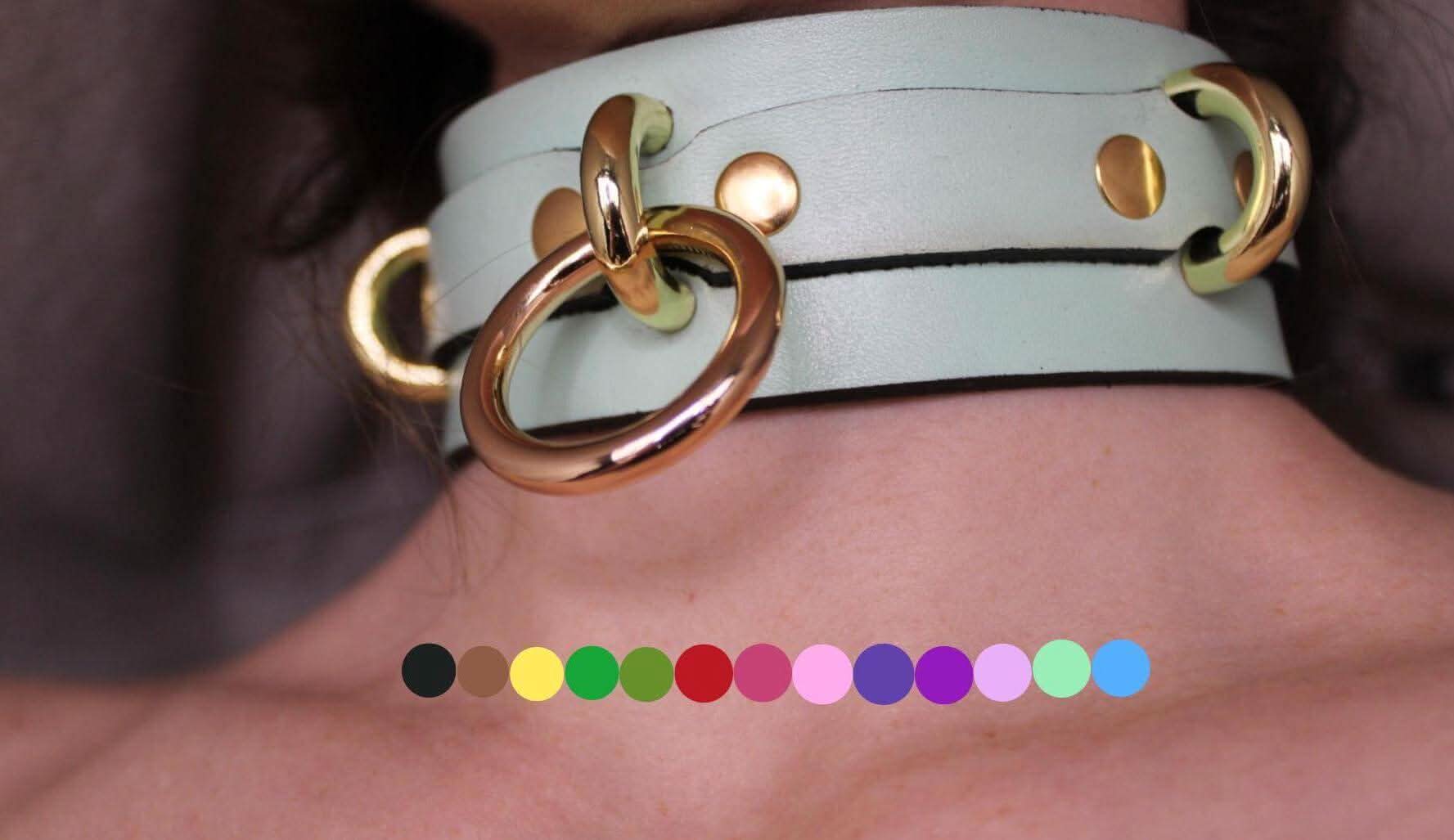 Mint green posture collar with gold O-rings, perfect as a submissive collar or BDSM accessory for added elegance.