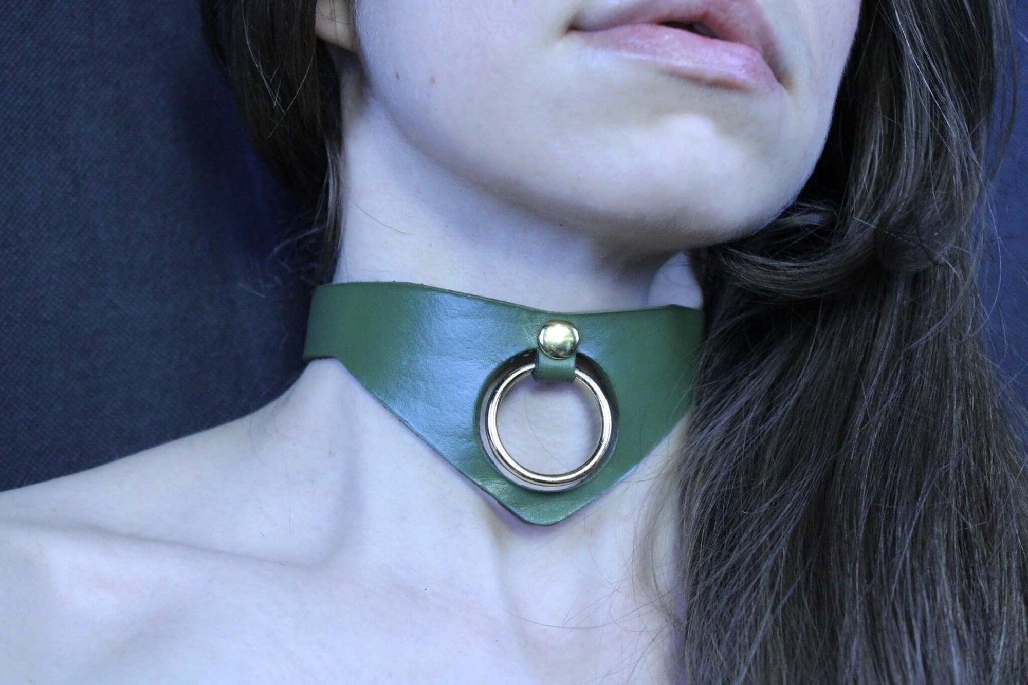 Olive green posture collar with bold O-ring, perfect for submissive jewelry and BDSM style.