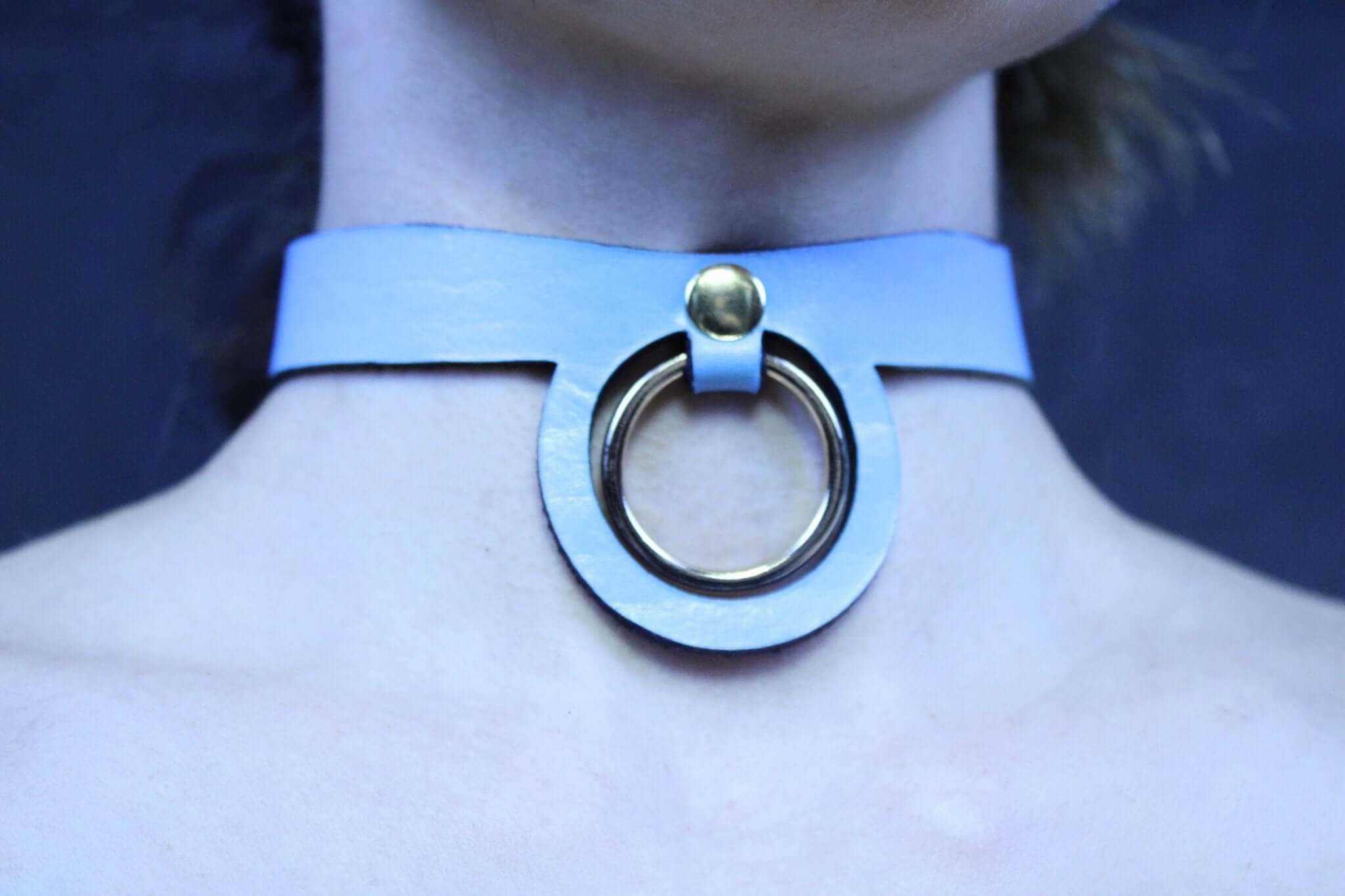 Pastel blue BDSM collar with a gold ring, ideal for submissive jewelry and discreet day collar wear.