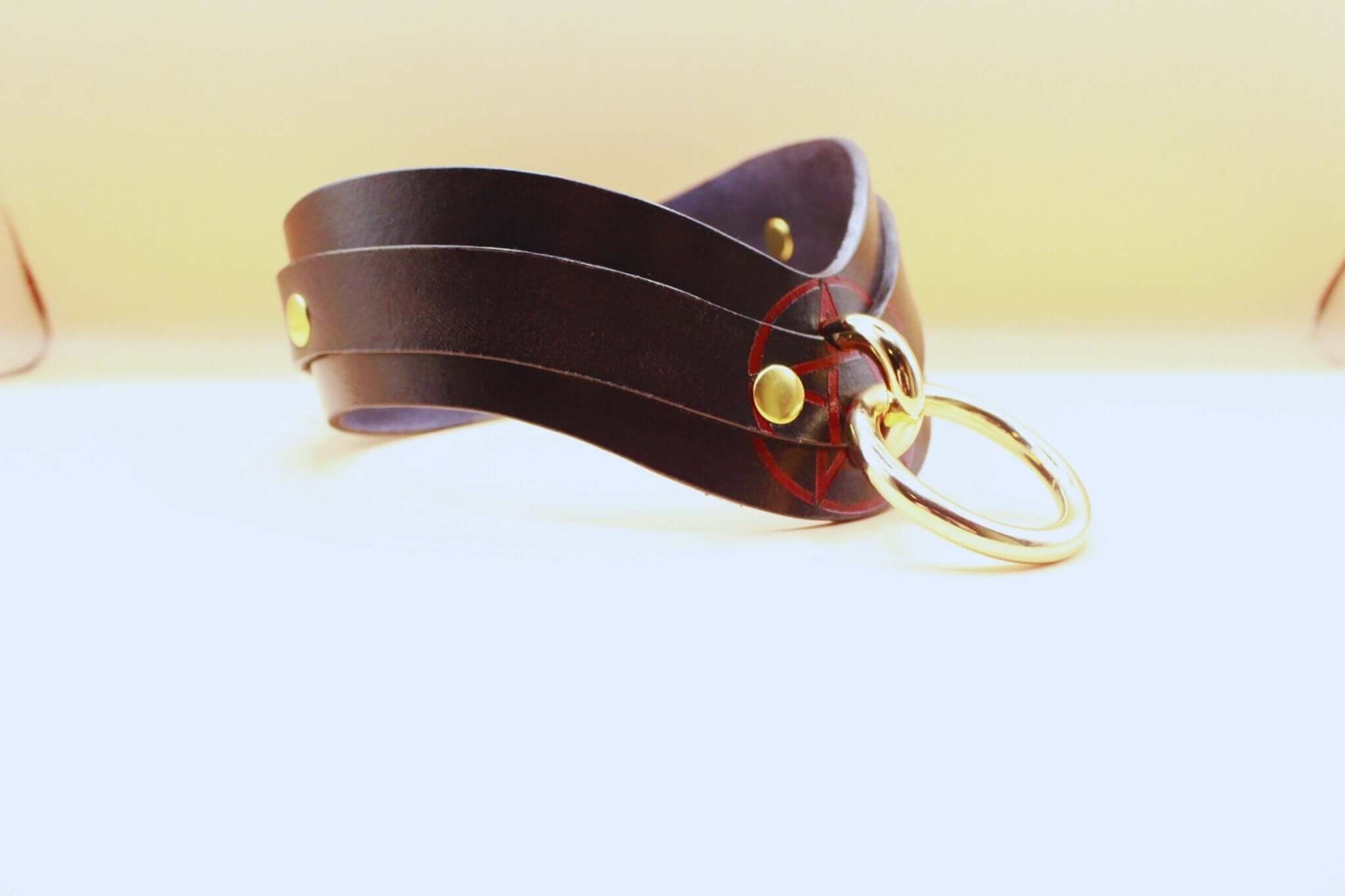 Handcrafted black leather BDSM collar with gold hardware, perfect for discreet day wear and sub collar enthusiasts.