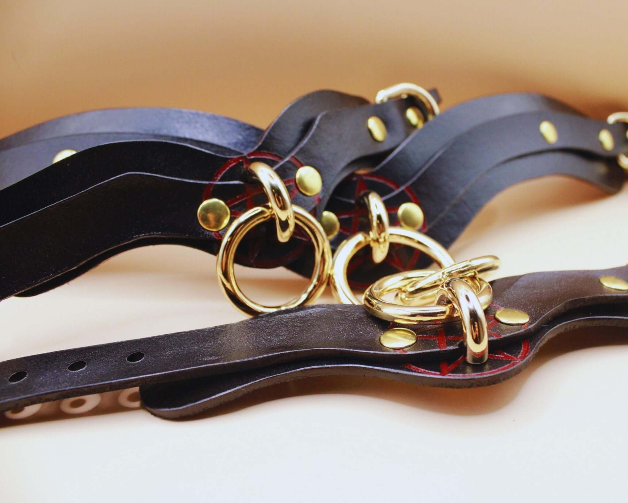 Luxurious black leather BDSM collar with gold hardware, ideal for sub collars and bondage gear.