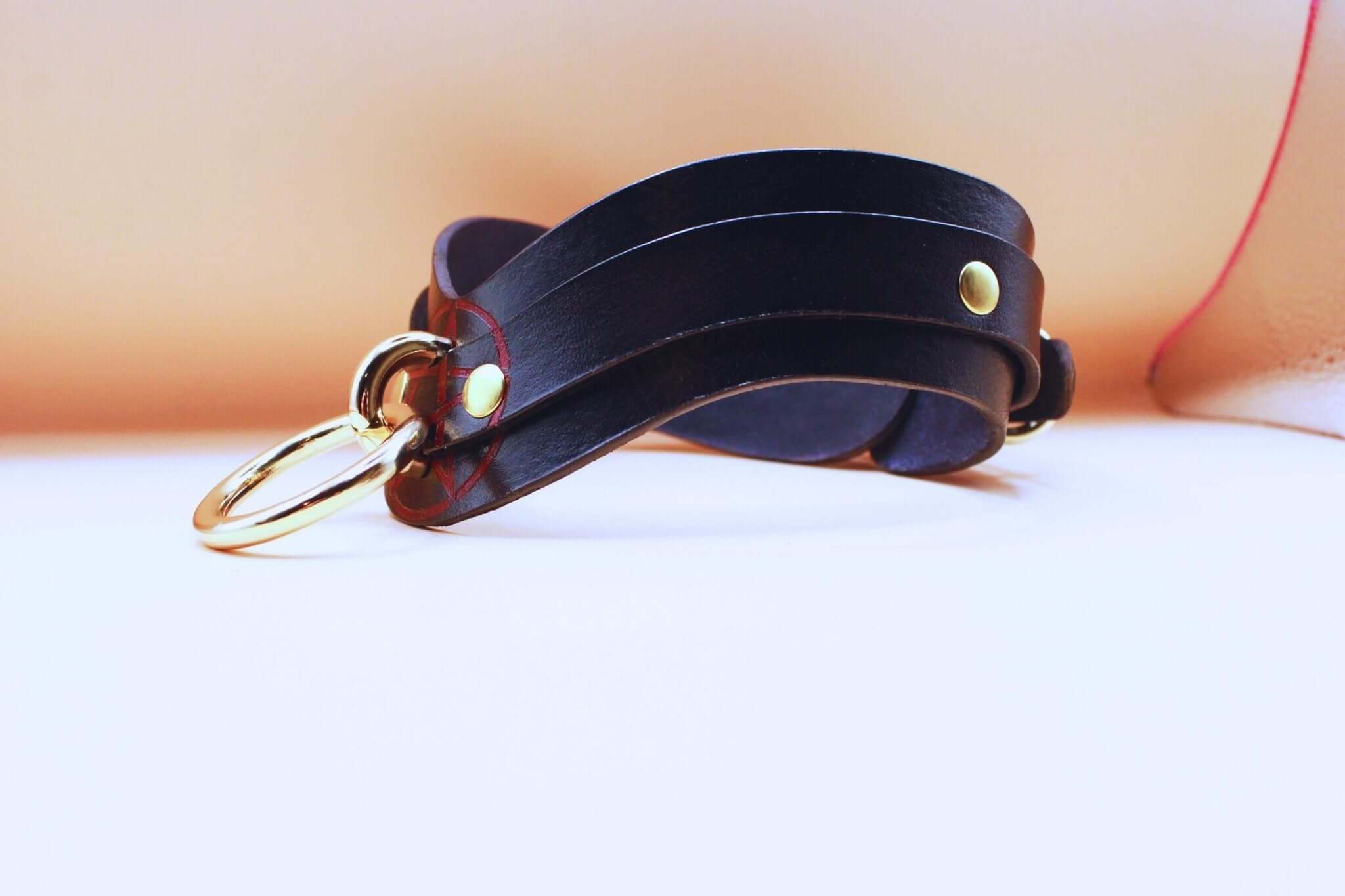 Elegant black leather Pentagram collar with gold accents, perfect for discreet BDSM or submissive jewelry wear.