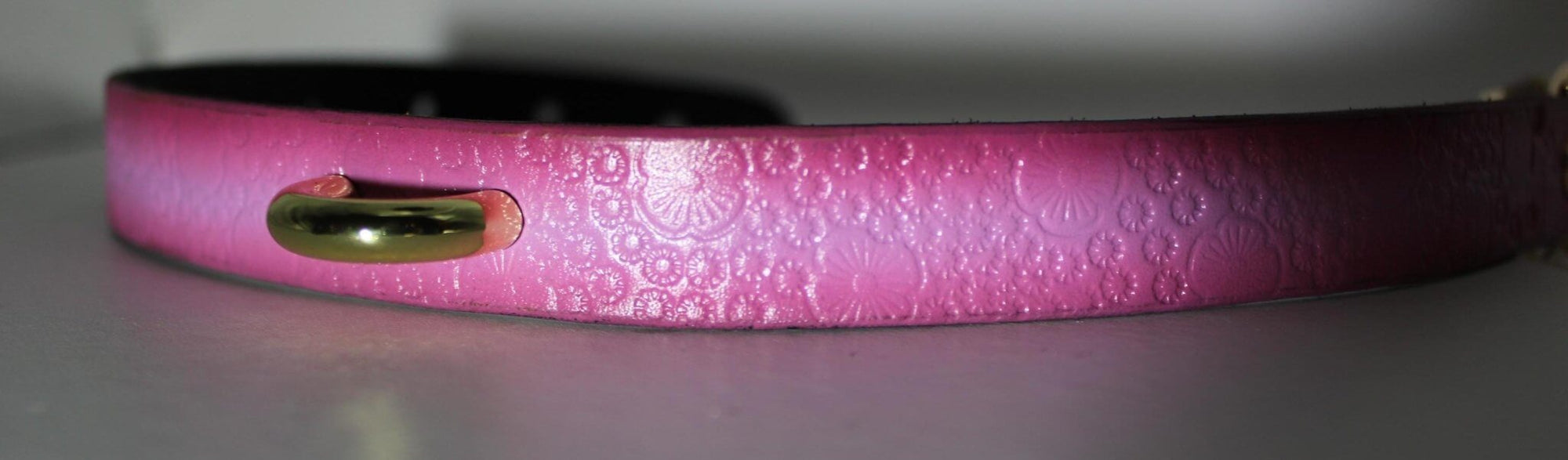 Pink floral embossed leather slave collar with O-ring, perfect for BDSM, submissive jewelry, and discreet day wear.