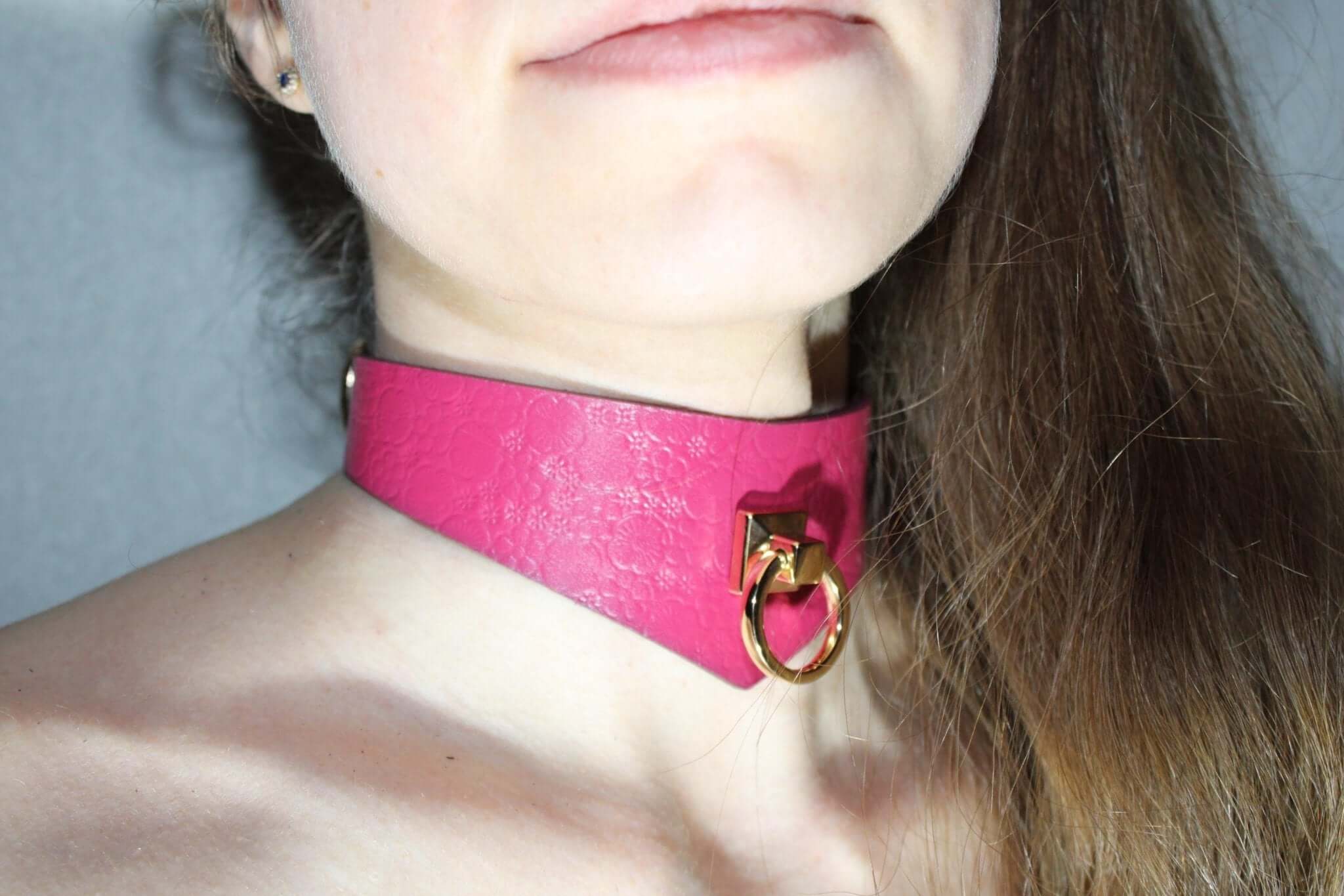 Stylish pink leather submissive collar with O-ring, perfect for BDSM play and as a discreet day collar.