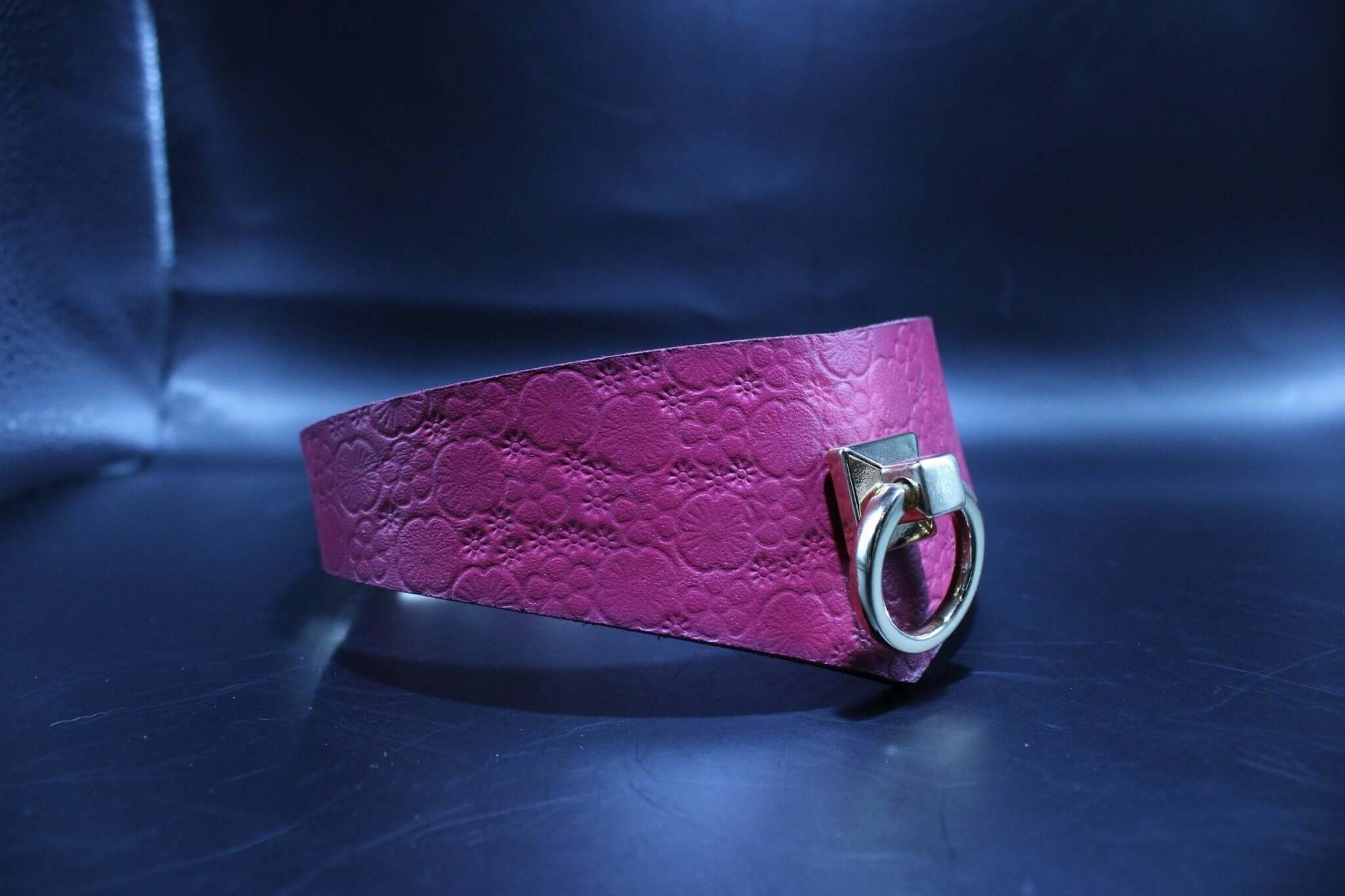 Handcrafted pink leather submissive collar with O-ring, perfect for BDSM, bondage play, and dom/sub gifting.