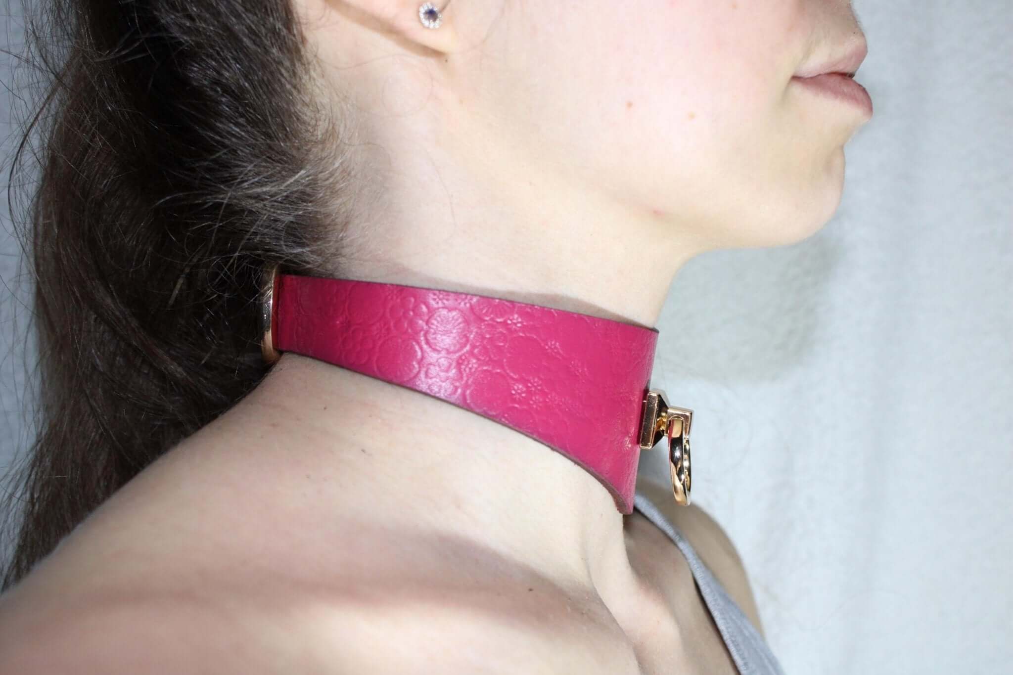Pink leather submissive collar showcasing style and sensuality, ideal for BDSM, bondage gear, and dom/sub dynamics.