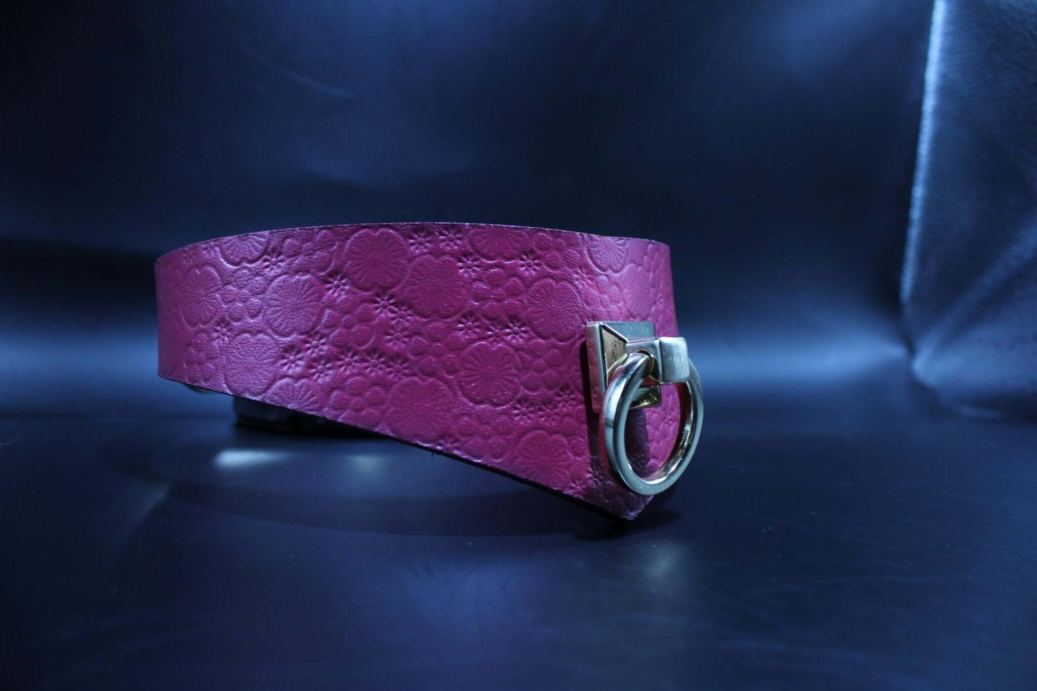 Handmade pink leather submissive collar with O-ring, ideal for bondage gear and BDSM play.