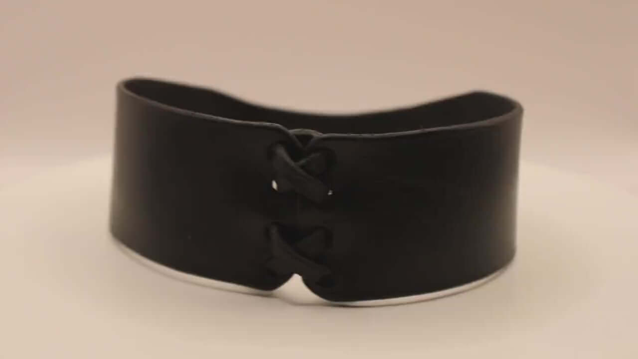 Discreet black leather bondage choker collar, ideal for submissive jewelry and BDSM roleplay.