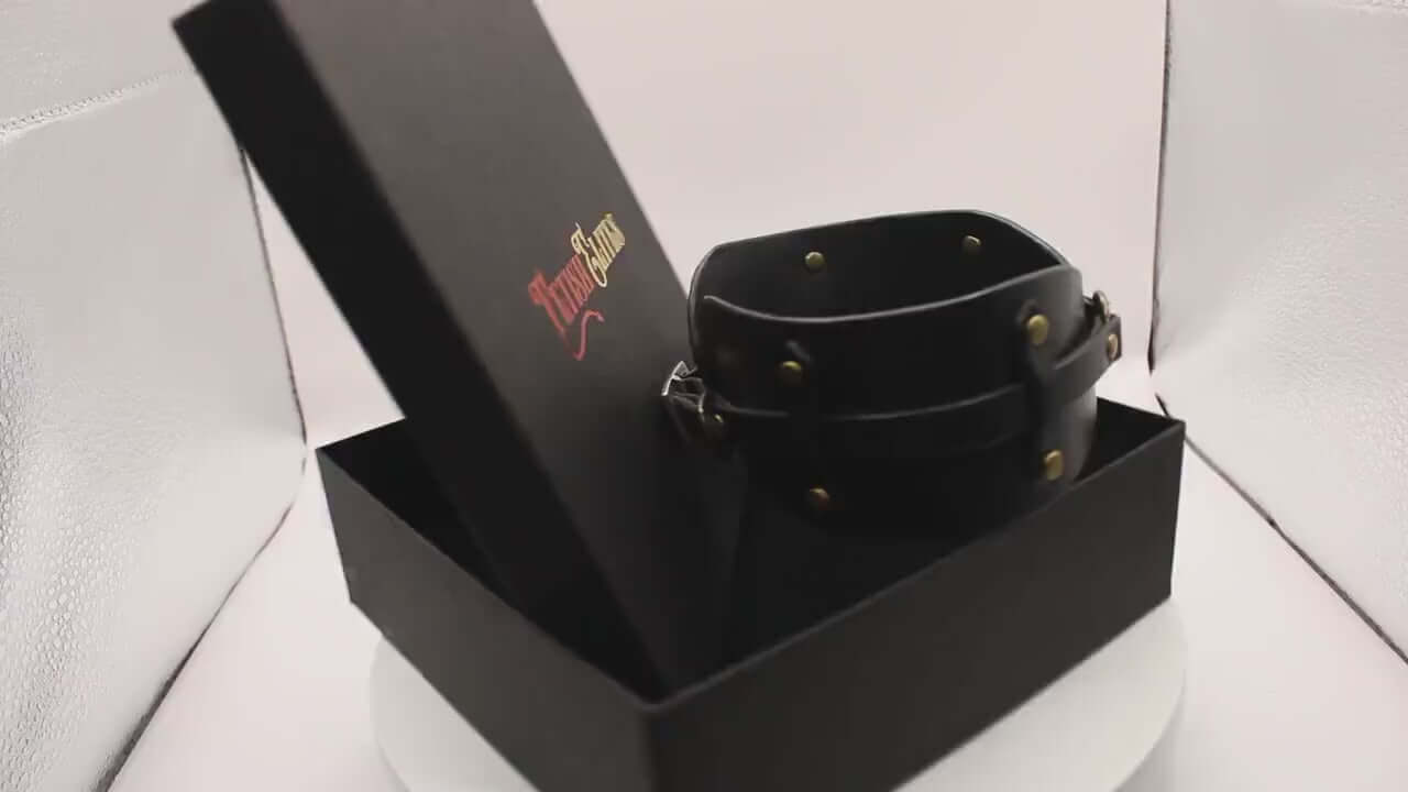 Edgy leather sub collar in elegant packaging, perfect for BDSM fashion and submissive jewelry enthusiasts.