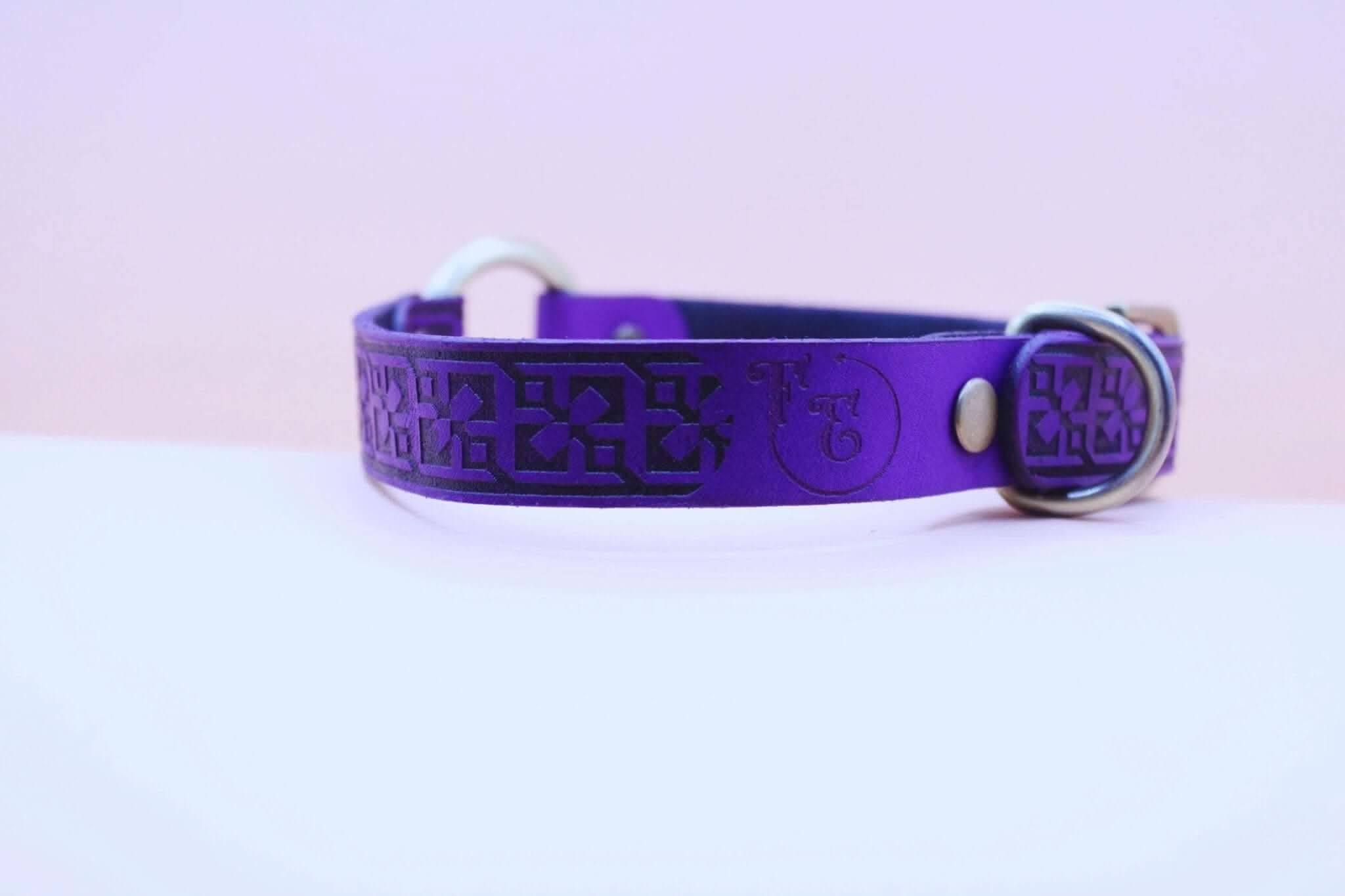 Purple leather bdsm collar with geometric pattern and O-ring, perfect for submissive jewelry and bondage gear.