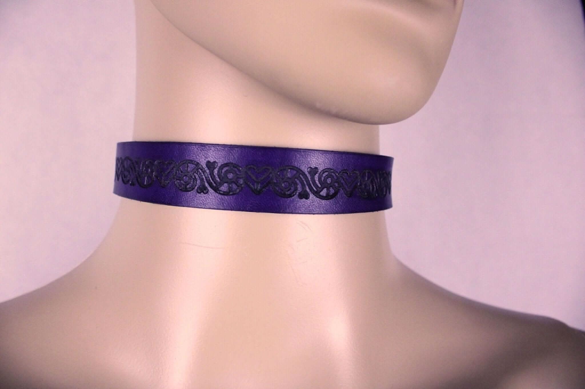 Purple leather BDSM collar featuring intricate design, ideal for discreet submissive jewelry and bondage fashion.
