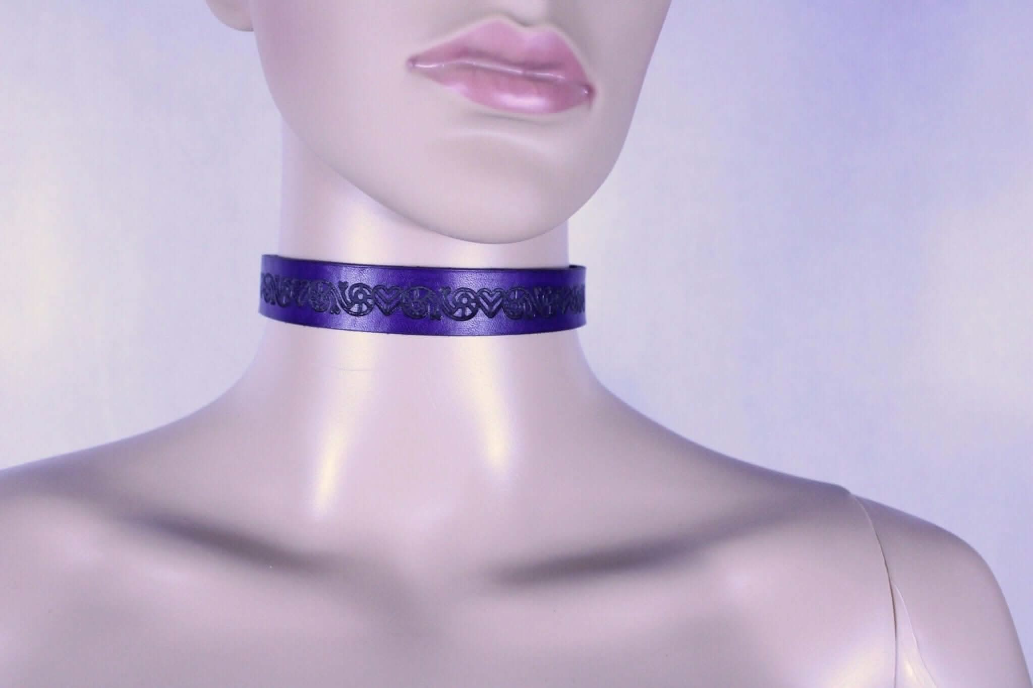 Purple leather BDSM collar showcasing elegant design, perfect for discreet submissive jewelry and erotic fashion.