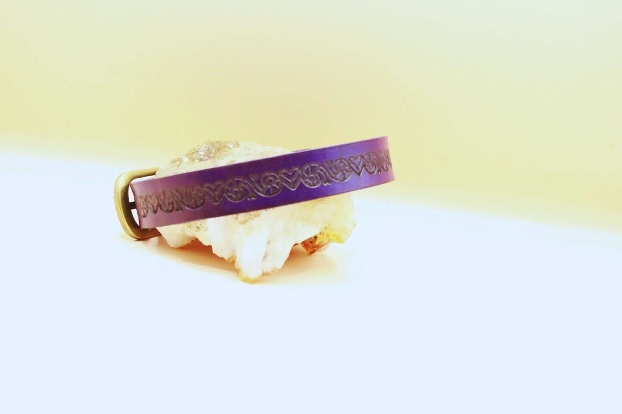 Purple leather BDSM sub collar featuring intricate designs, ideal for discreet style in submissive jewelry collections.