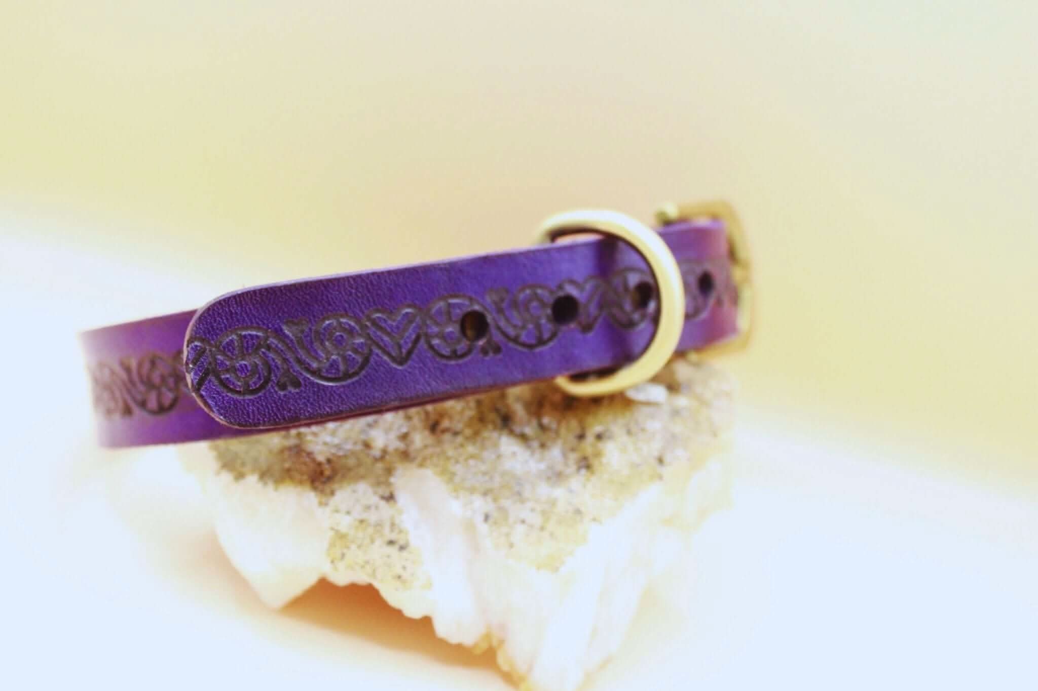 Purple leather BDSM collar with decorative design, perfect for discreet sub wear and submissive jewelry collections.