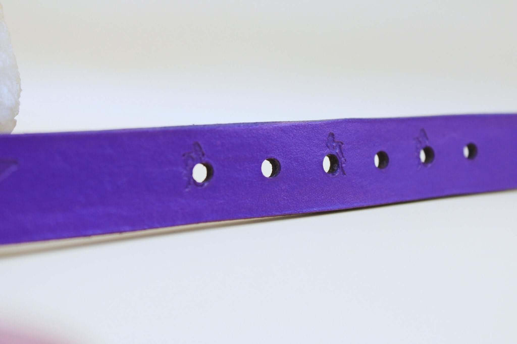 Purple BDSM collar strap showcasing holes for adjustable fit, perfect for submissive jewelry and bondage aesthetics.