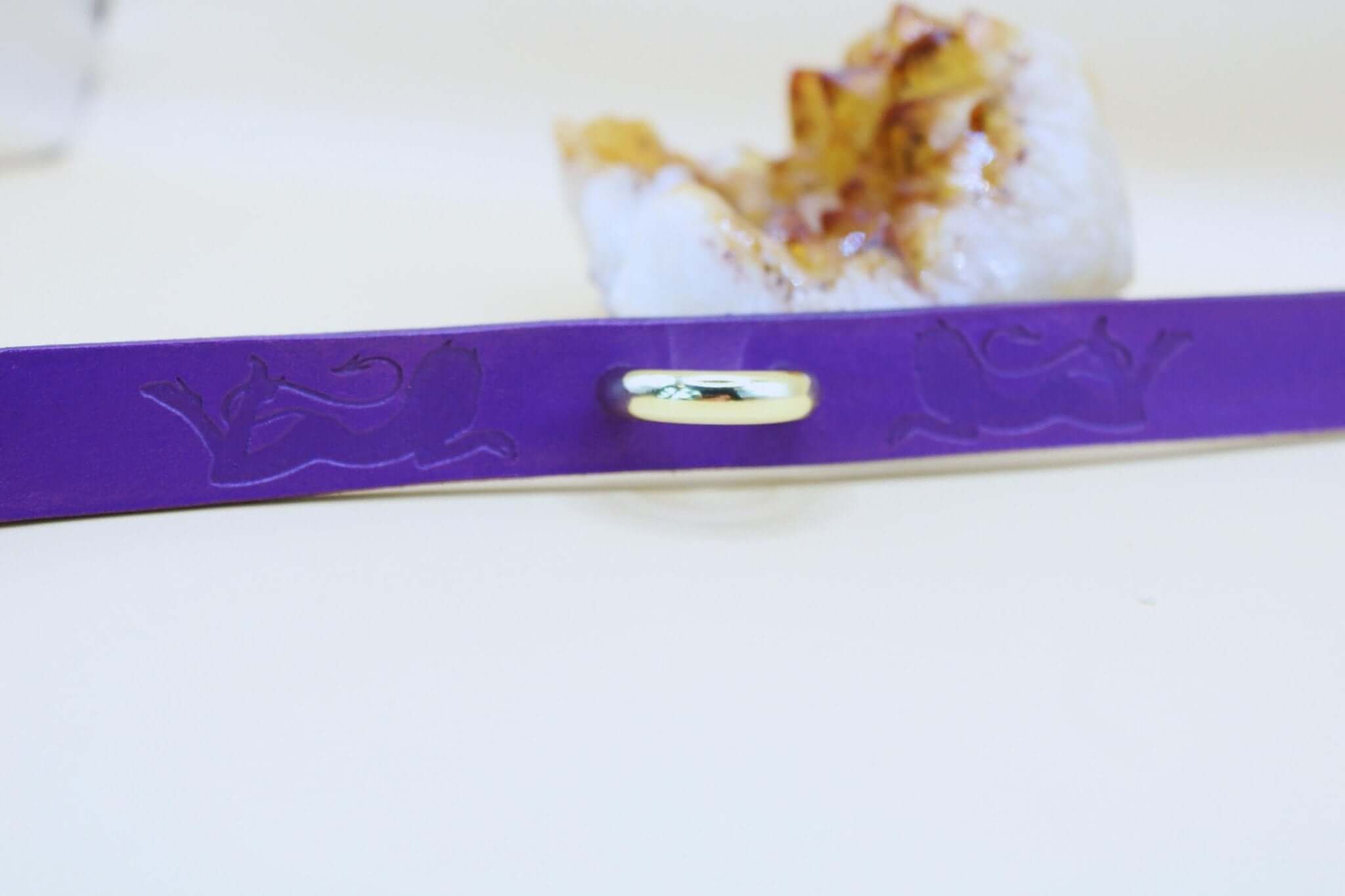 Elegant purple submissive collar handcrafted for BDSM, featuring a silver-tone centerpiece and intricate design.