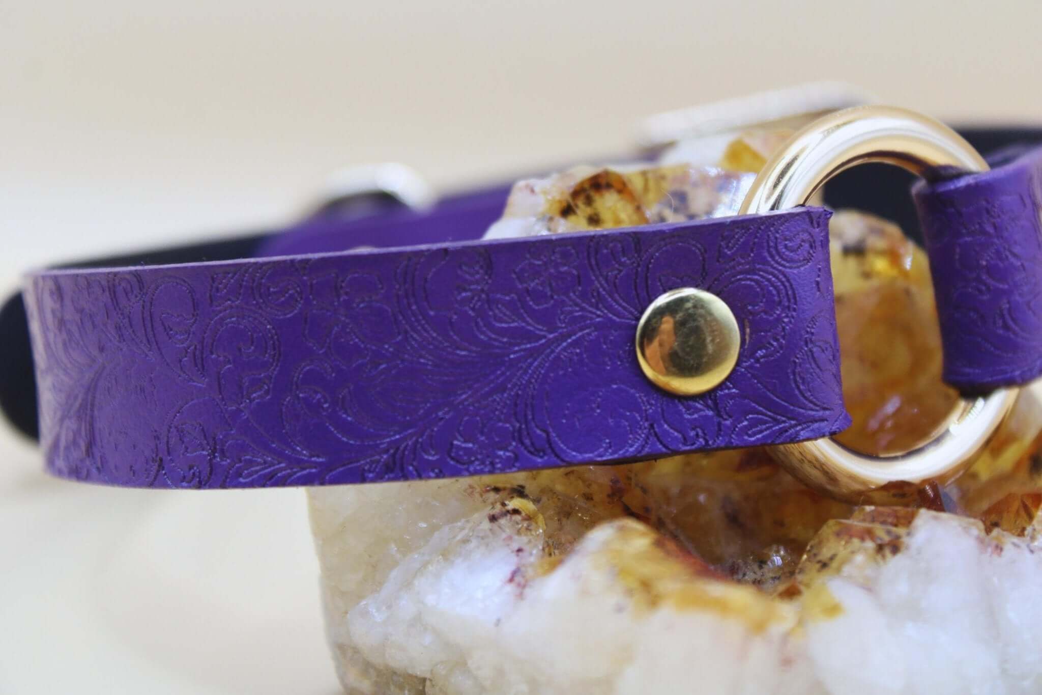 Purple embossed leather BDSM collar with O-ring, perfect for submissive jewelry and discreet day wear.