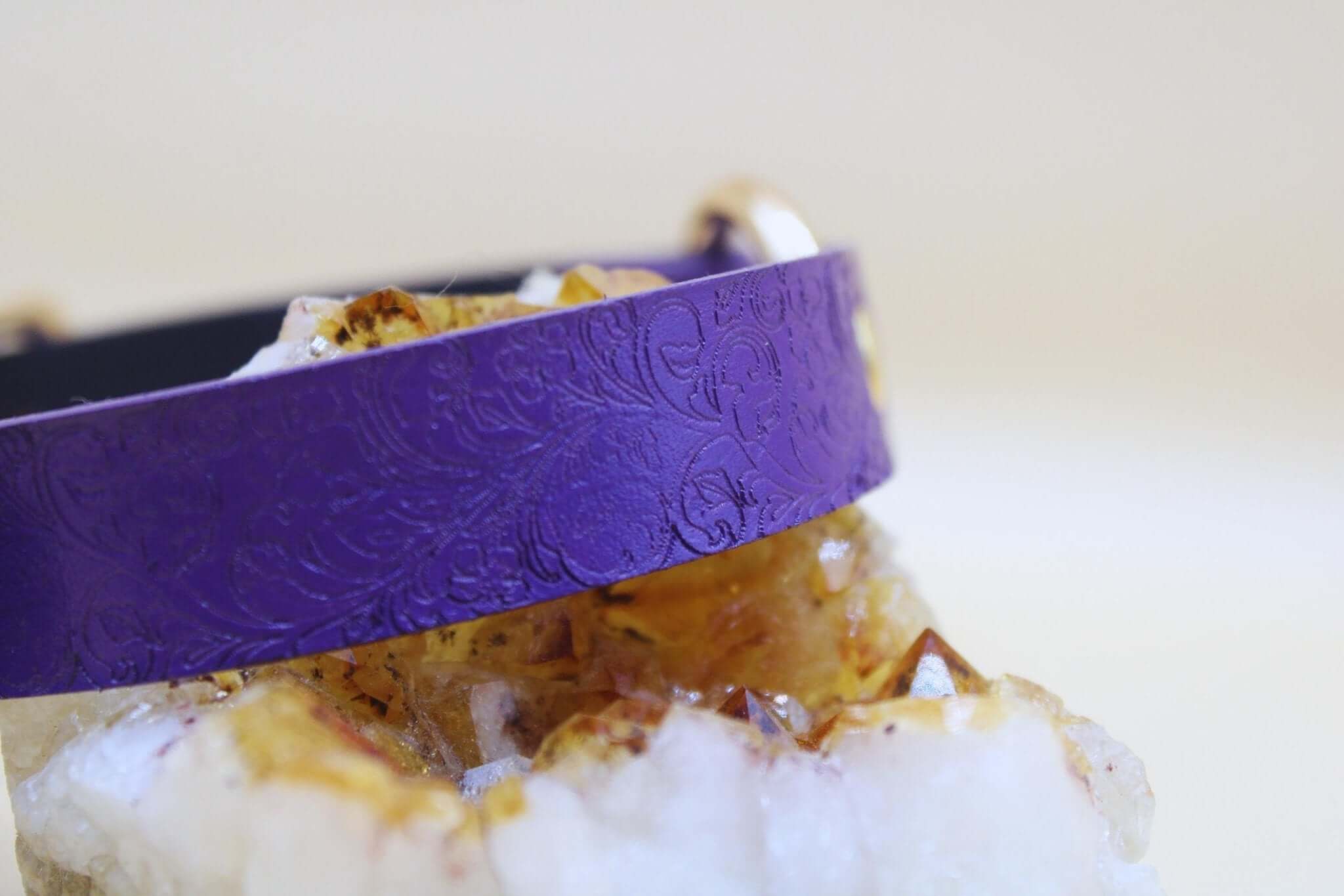 Purple BDSM collar with embossed floral pattern, ideal for submissive jewelry and discreet day collar use.