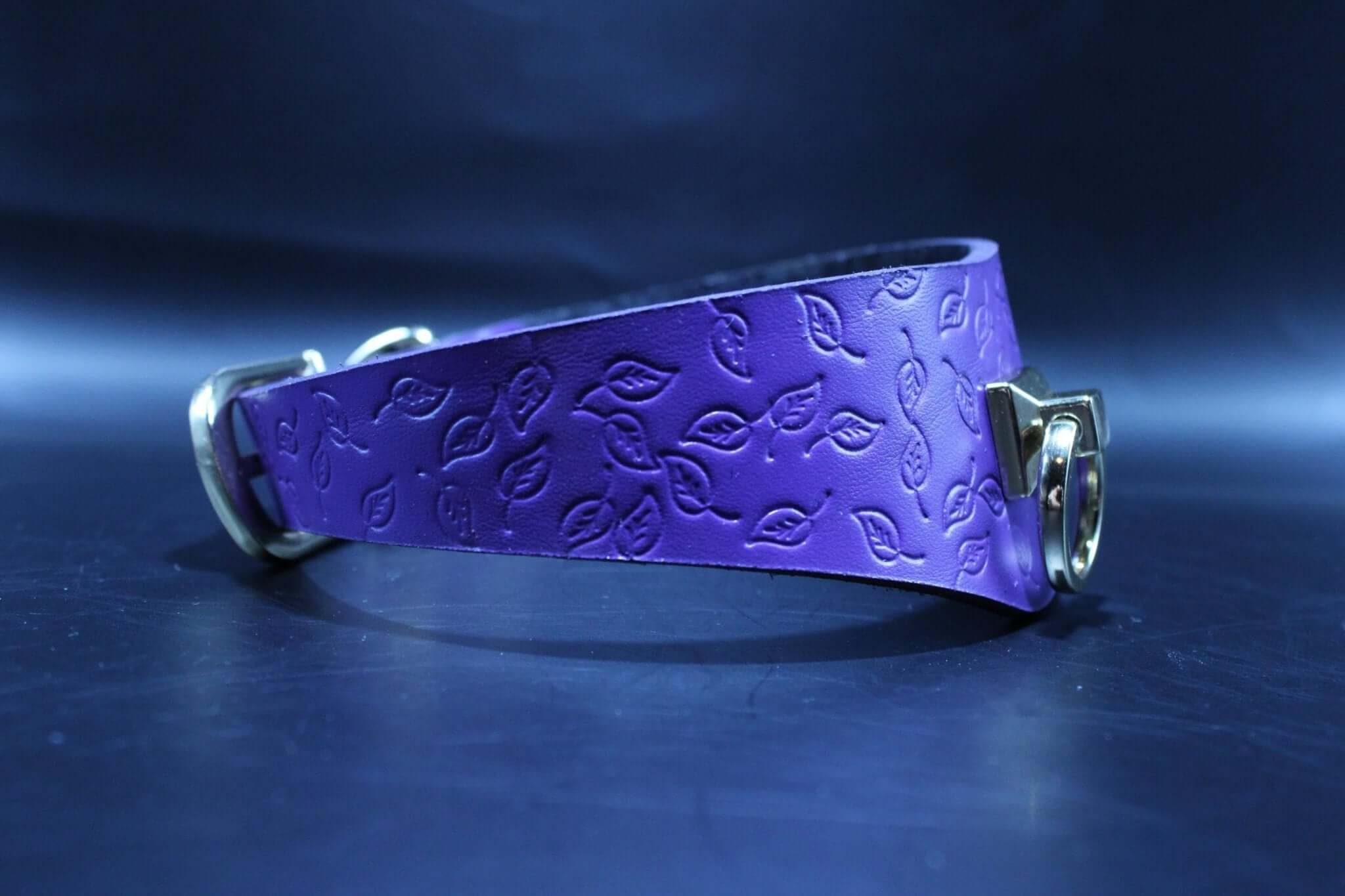 Purple leather BDSM collar with embossed leaf design, perfect as a submissive collar or discreet day collar.