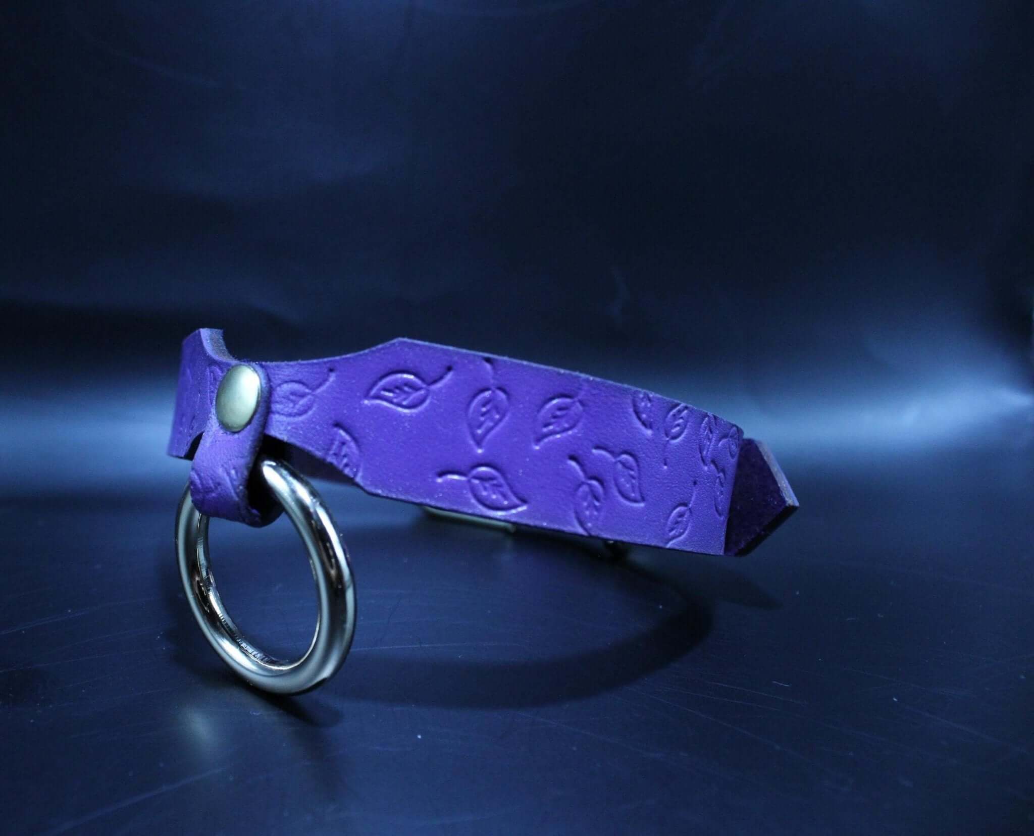 Elegant purple leaf BDSM collar with O-ring, a stylish submissive jewelry piece for bondage enthusiasts.