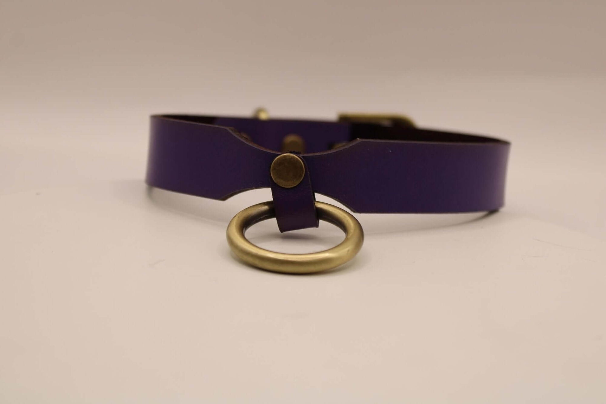 Purple leather BDSM collar with metal ring, ideal for sub play and aesthetic jewelry, perfect for discreet day wear.