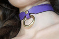 Elegant purple leather submissive collar with metal ring, perfect for BDSM and versatile day wear.