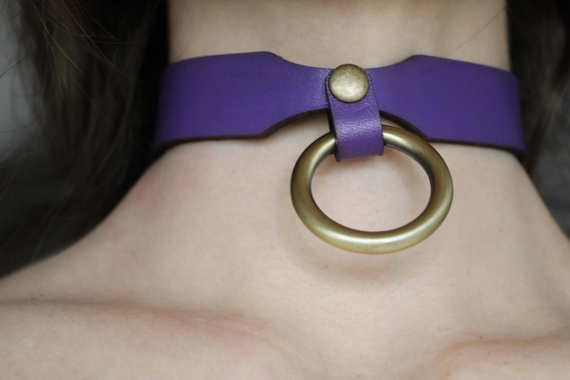 Purple leather sub collar with brass ring, perfect for BDSM and discreet wear, a blend of elegance and boldness.