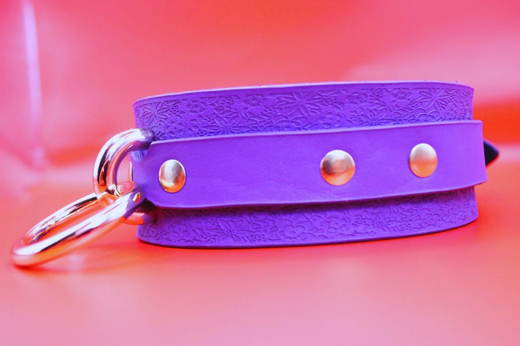Stylish purple leather collar with metal studs, perfect for BDSM, submissive jewelry, and discreet day wear.