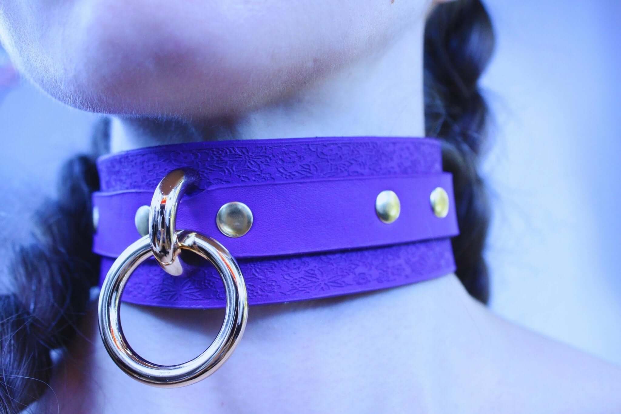Purple leather choker collar with gold accents, perfect for BDSM style and discreet day wear, empowering and elegant.