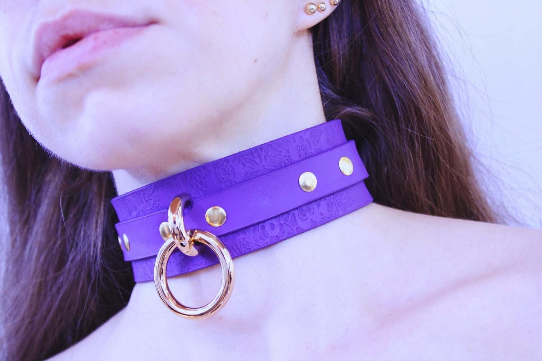 Elegant purple leather choker with gold studs, perfect for BDSM and discreet day collar wear.