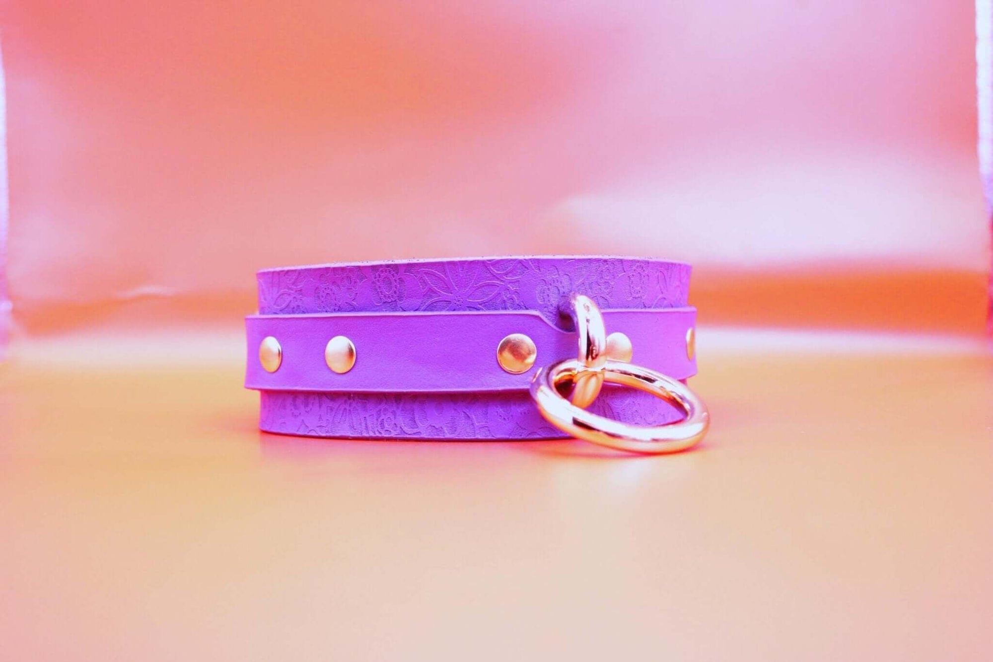 Purple leather choker with gold accents, perfect as a discreet collar for BDSM or everyday submissive jewelry.
